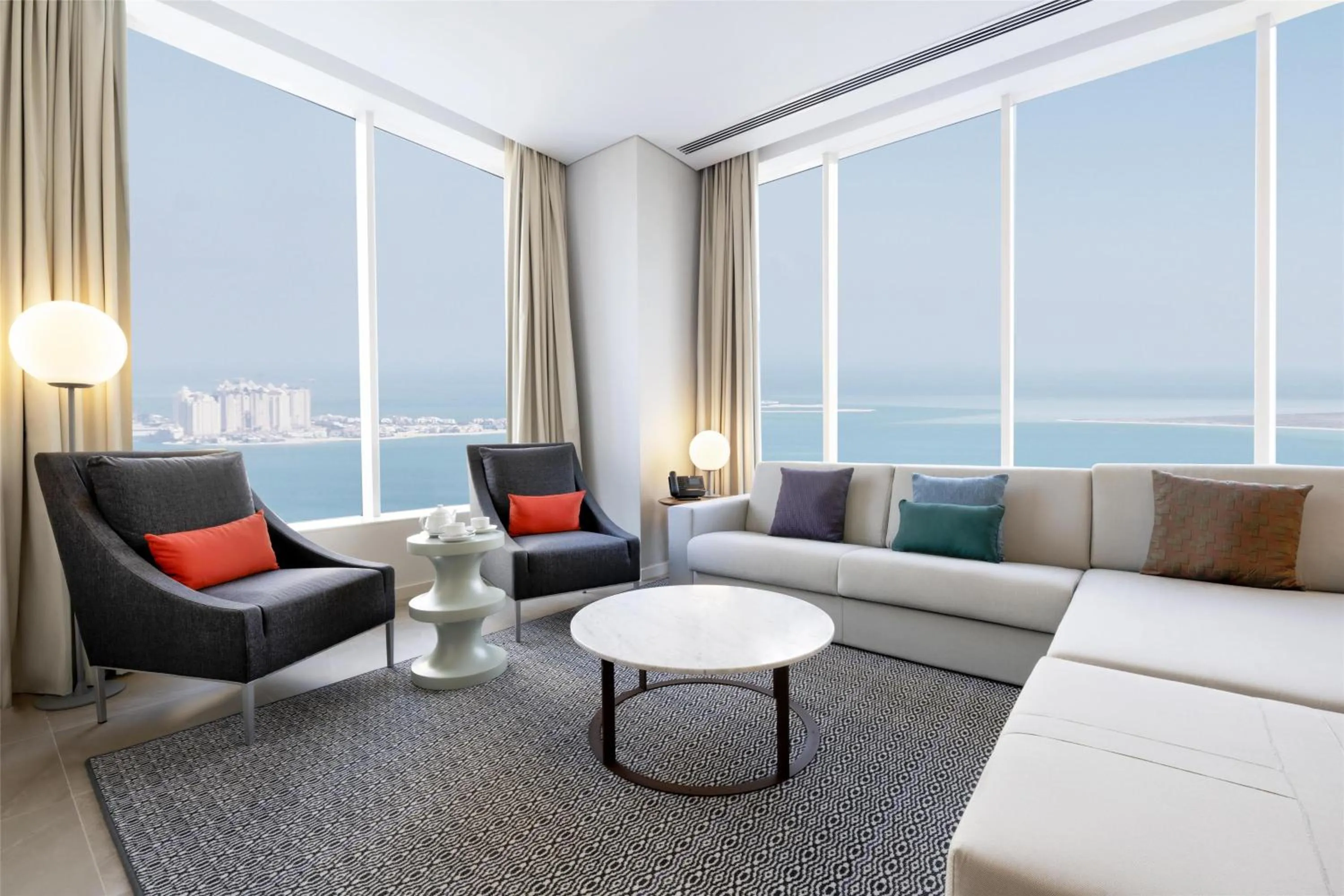 Living room in Aleph Doha Residences, Curio Collection By Hilton