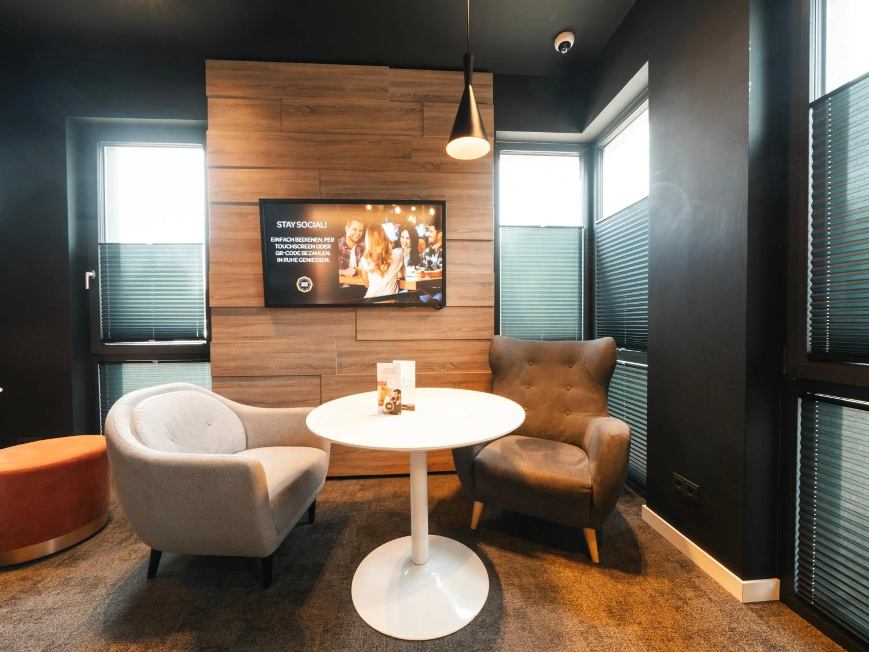 Communal lounge/ TV room in JustStay Grevenbroich Hotel & Apartments