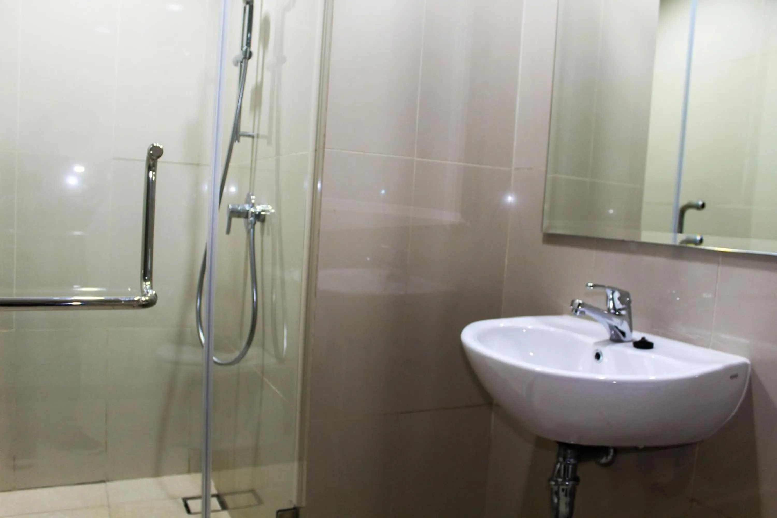 Bathroom in Minimalist 1BR Apartment at M-Town Signature By Travelio