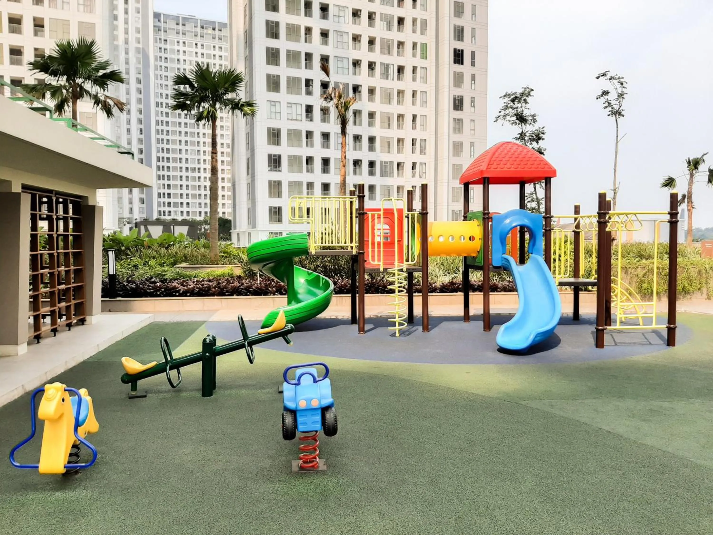 Children play ground in Minimalist 1BR Apartment at M-Town Signature By Travelio