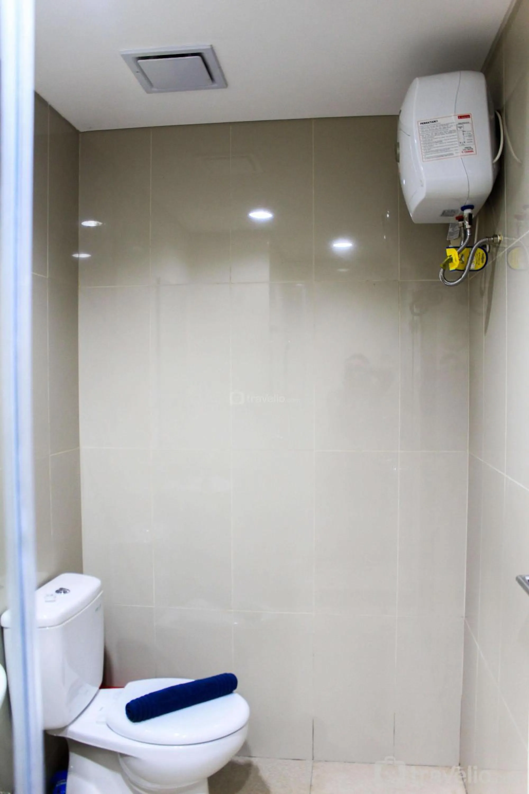 Bed in Minimalist 1BR Apartment at M-Town Signature By Travelio