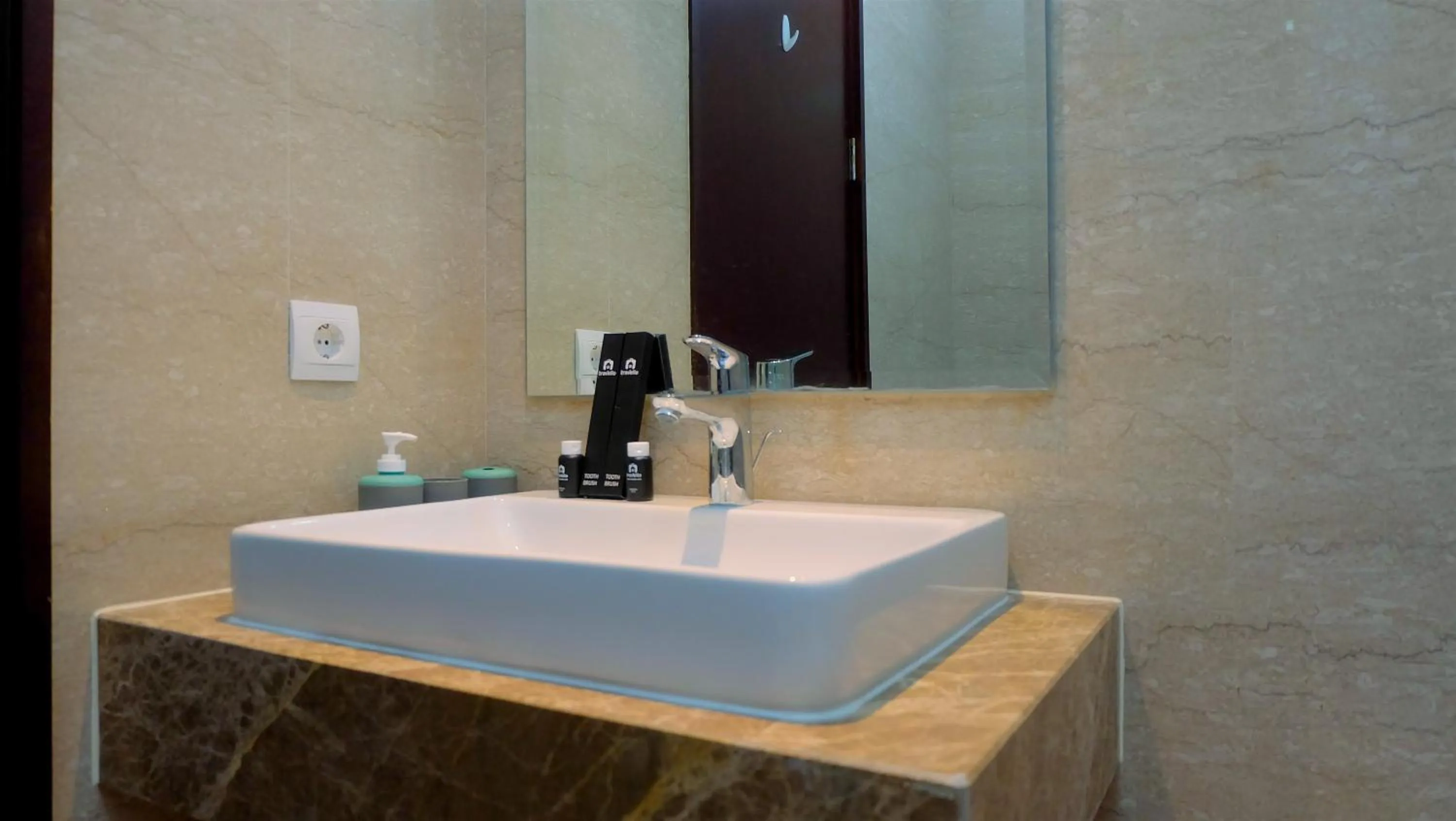 Bathroom in Classy 2BR Apartment at Menteng Park with City View By Travelio