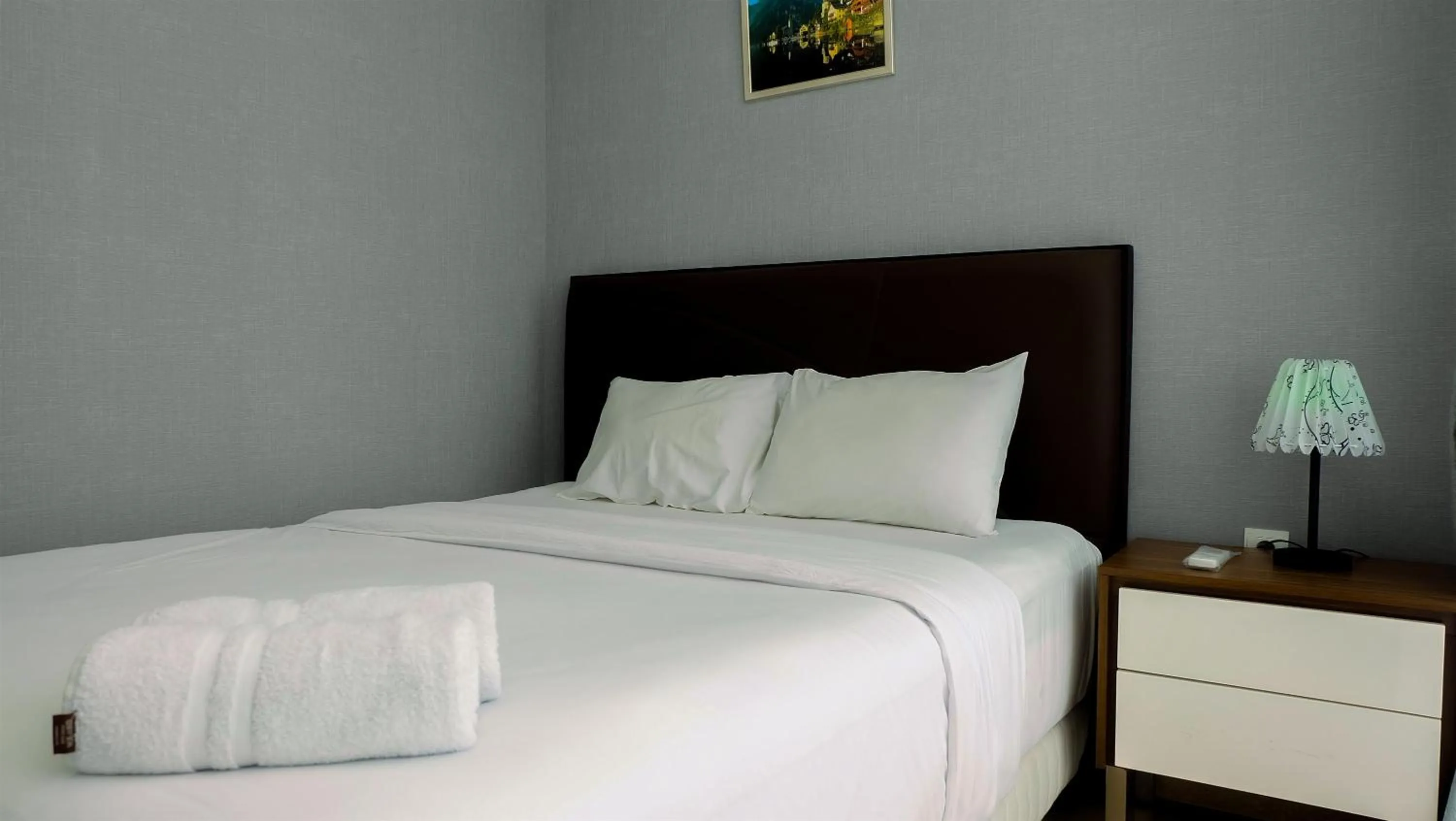 Bed in Classy 2BR Apartment at Menteng Park with City View By Travelio