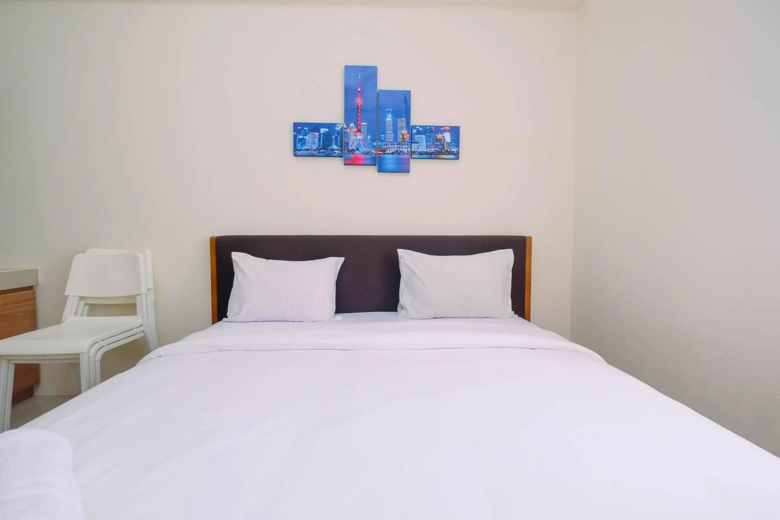 Bed in Homey Studio Apartment at Bogorienze By Travelio