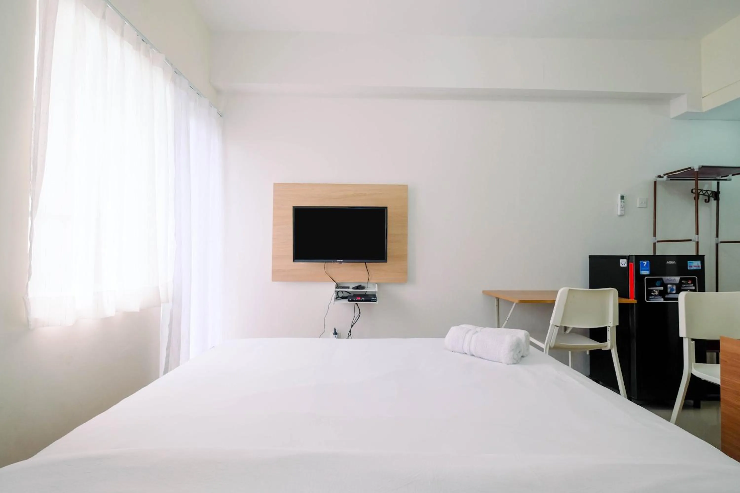 Bed in Homey Studio Apartment at Bogorienze By Travelio