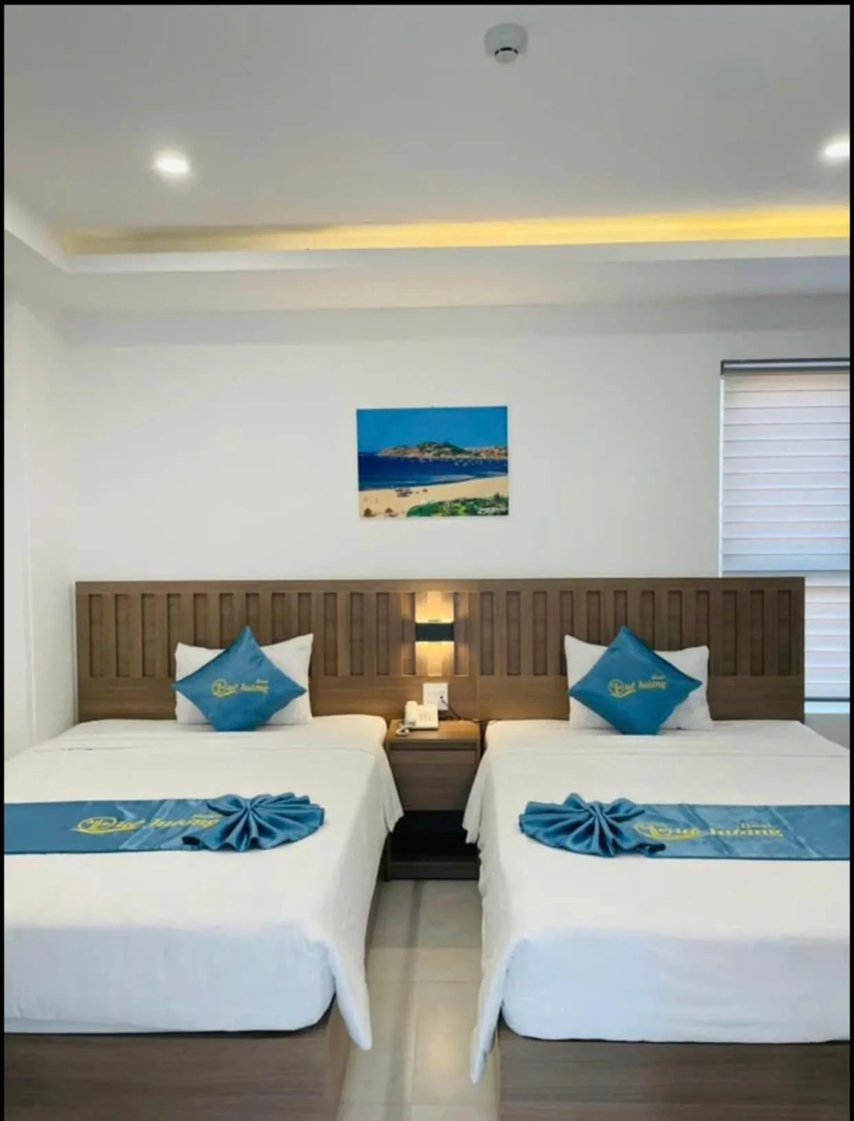 Bed in QUE HUONG HOTEL