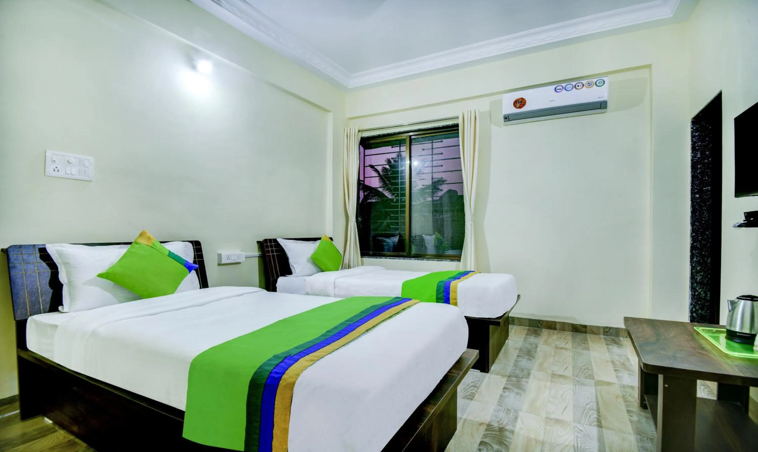 Bed in Treebo Sayaji Residency