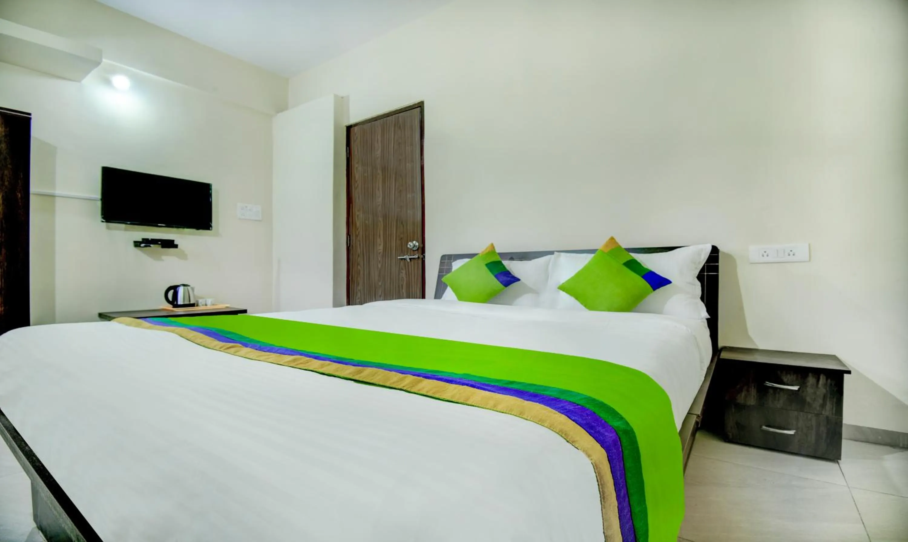 Bed in Treebo Sayaji Residency