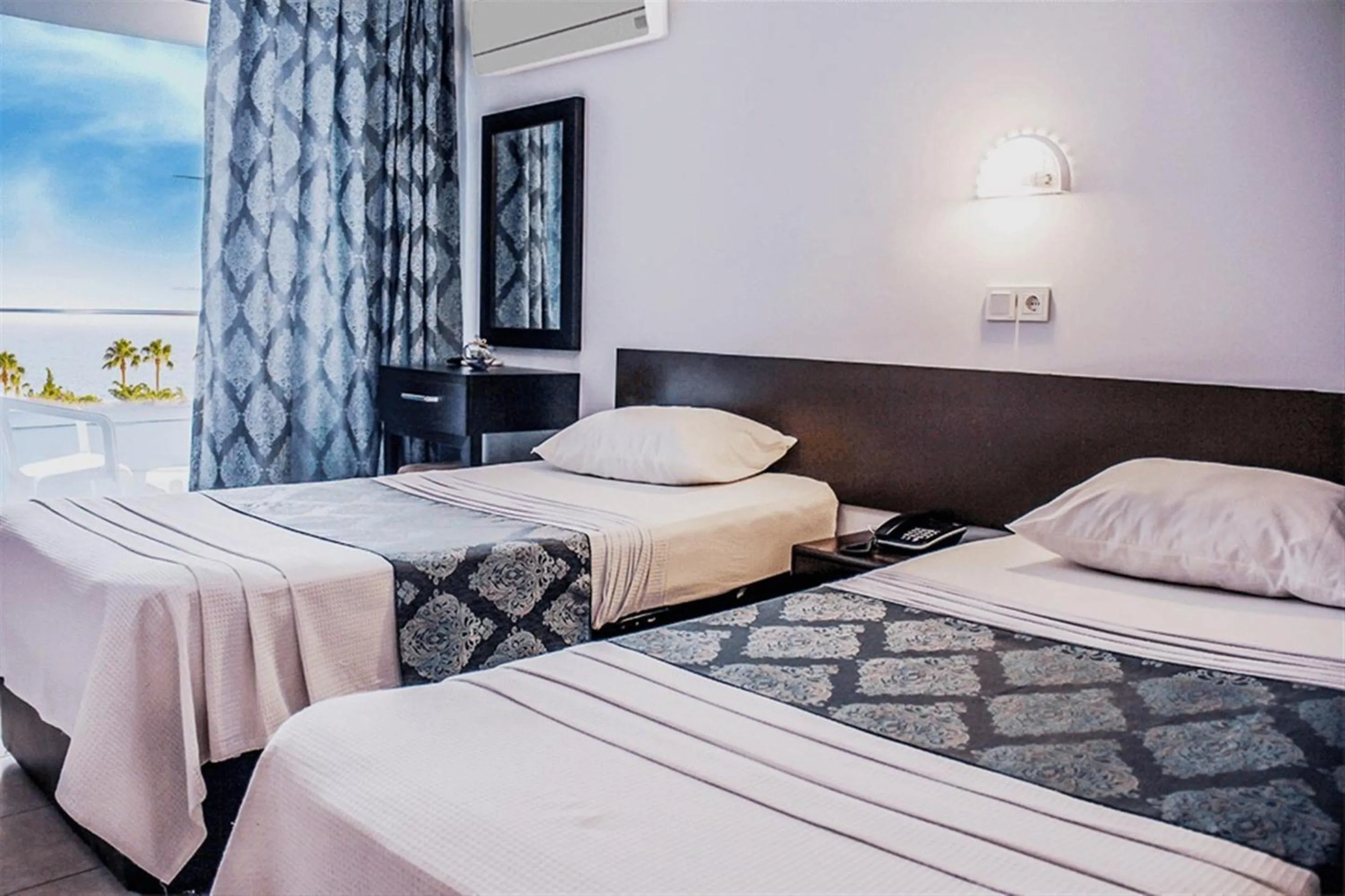Bed in Yaman Life Hotel