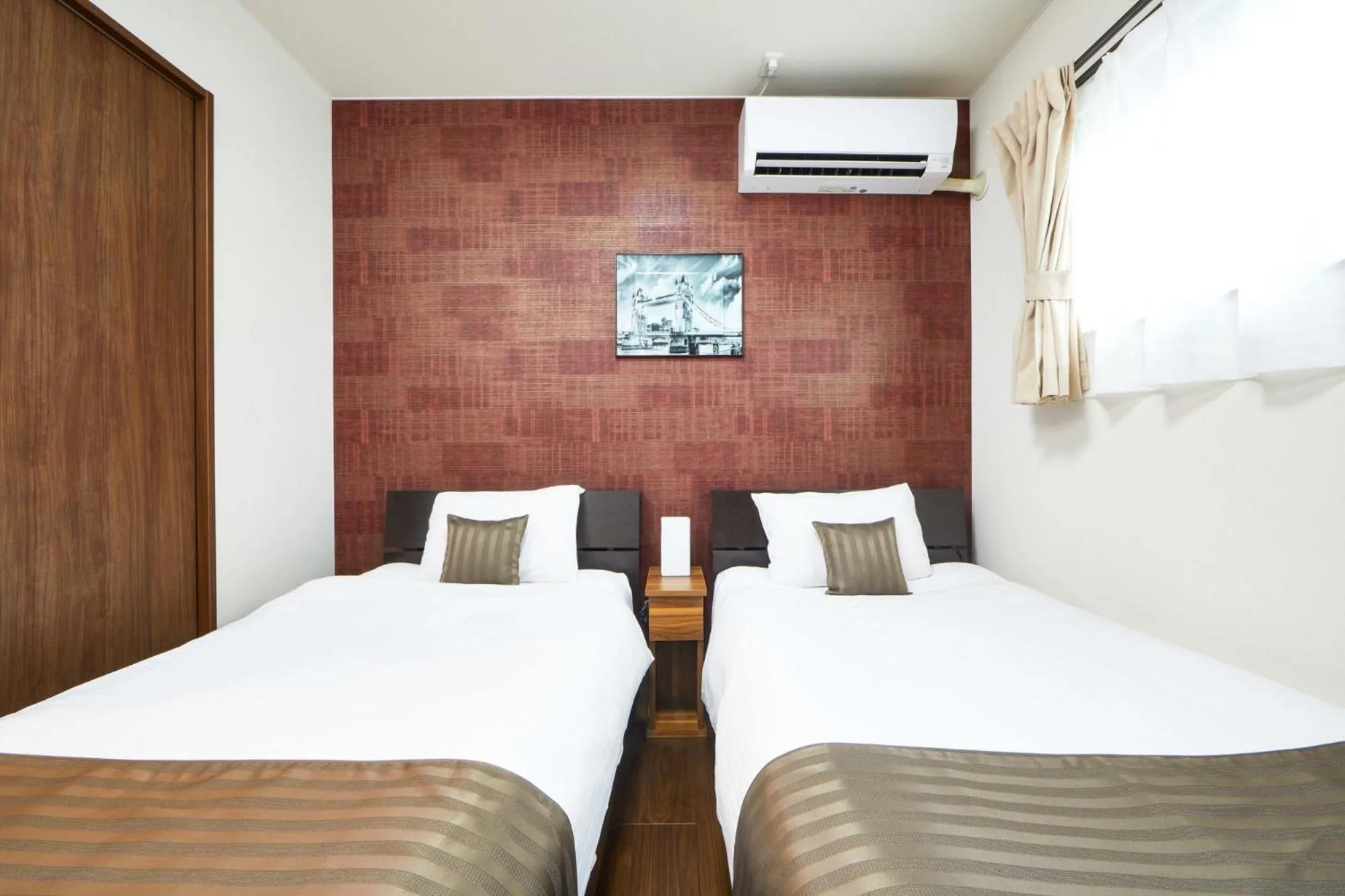 Bed in E-horizon Resort コンドミニアム名護D