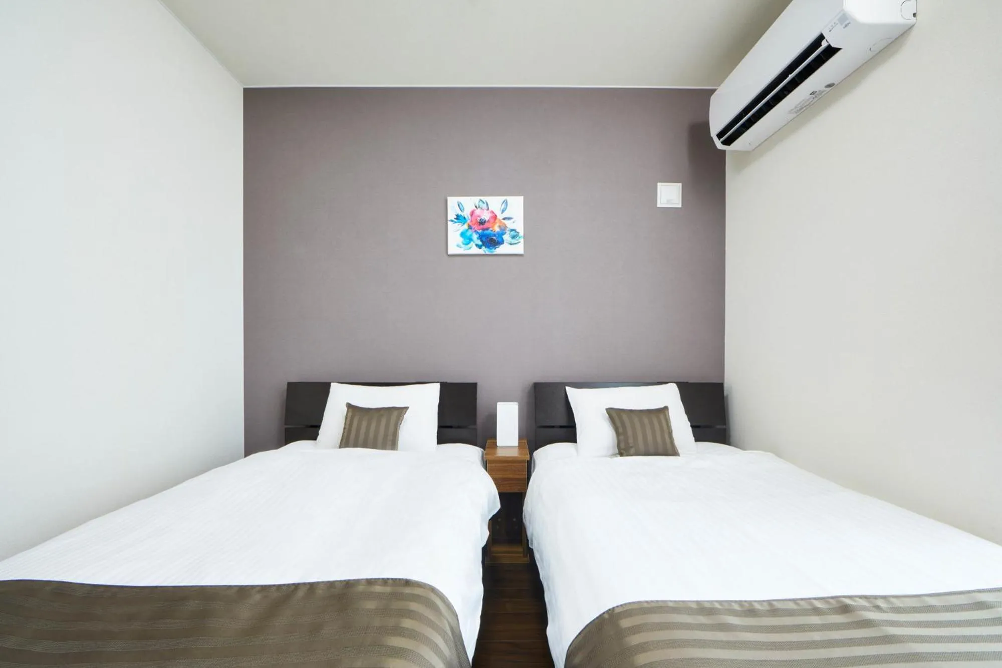 Bed in E-horizon Resort コンドミニアム名護D