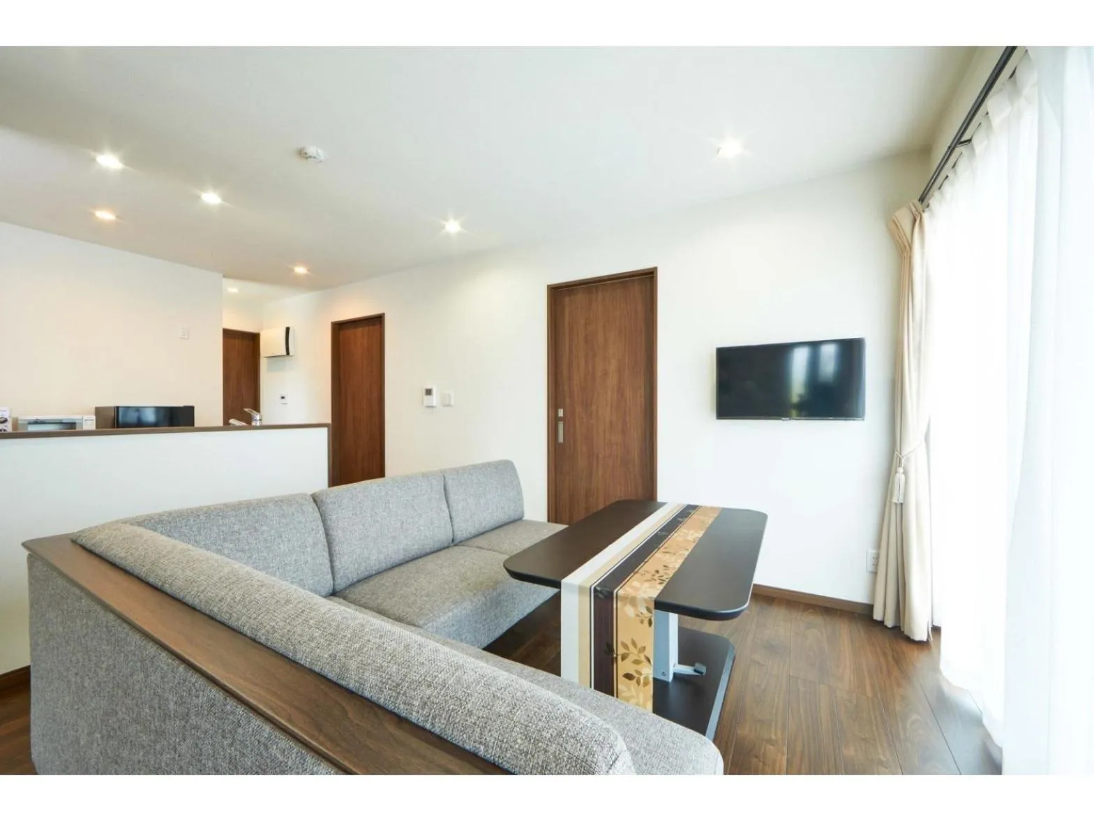 Living room in E-horizon Resort コンドミニアム名護D