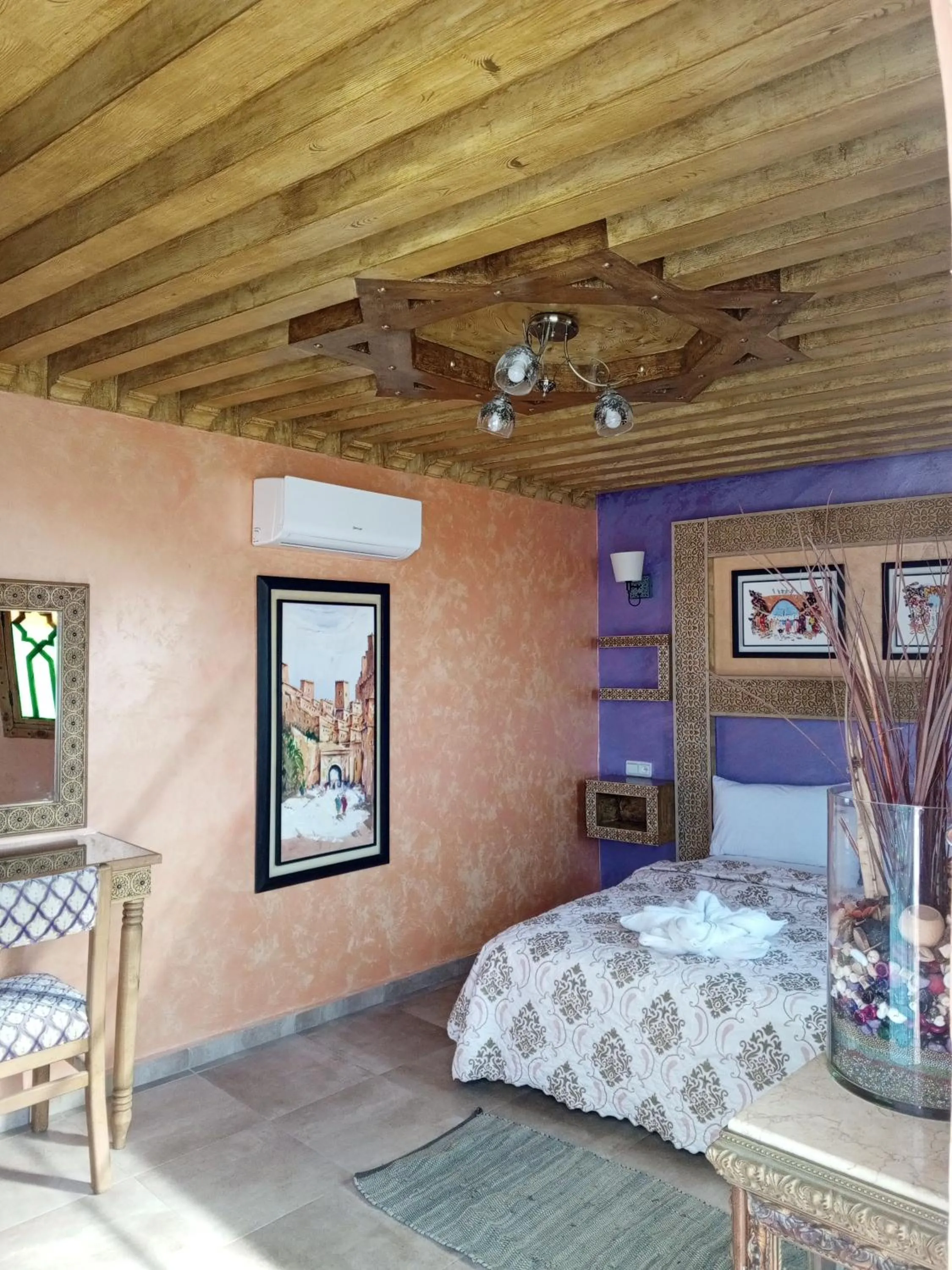 fireplace, Bed in RIAD ESMERALDA By Dar Ouezzani