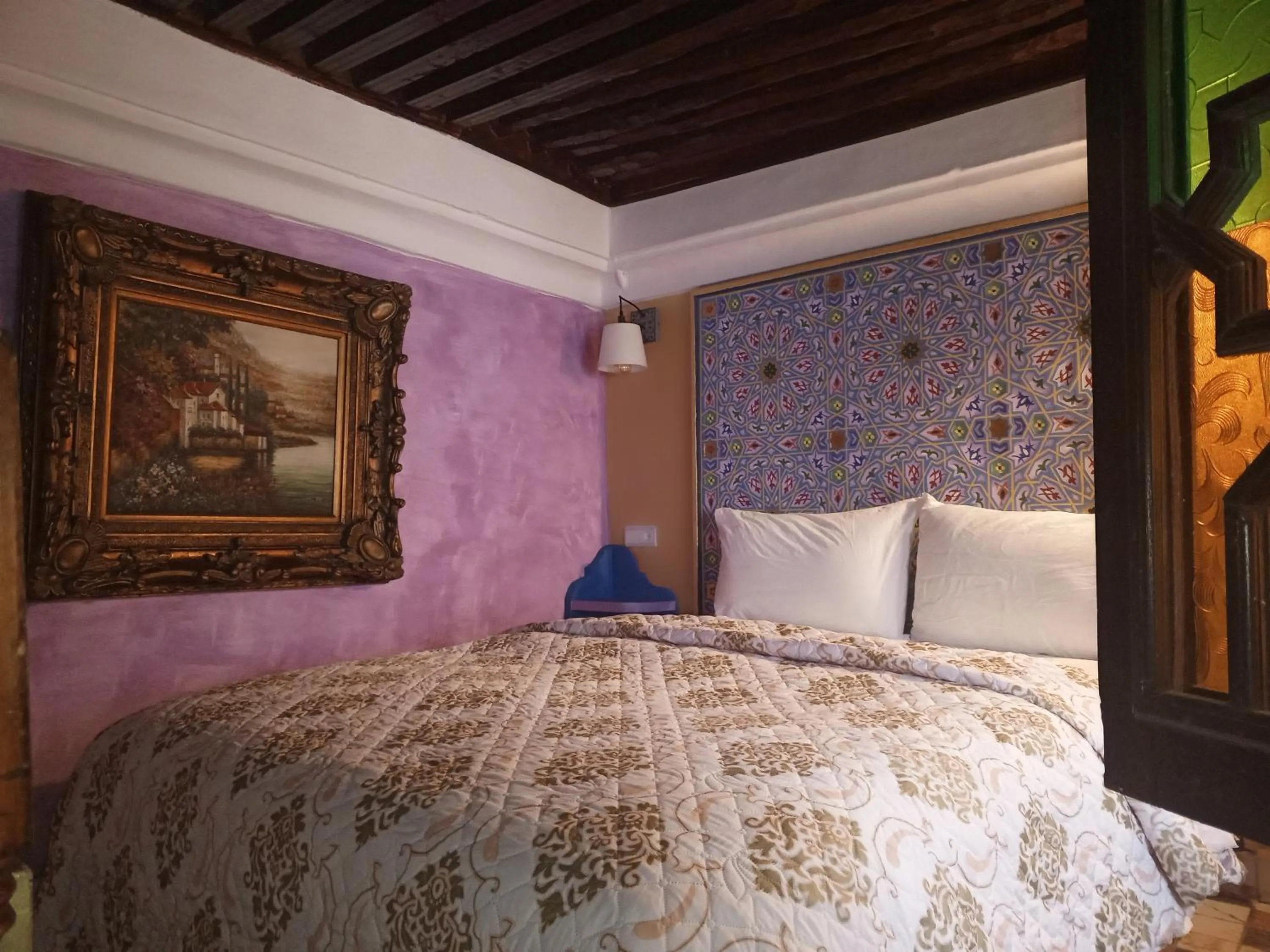 Photo of the whole room, Bed in RIAD ESMERALDA By Dar Ouezzani