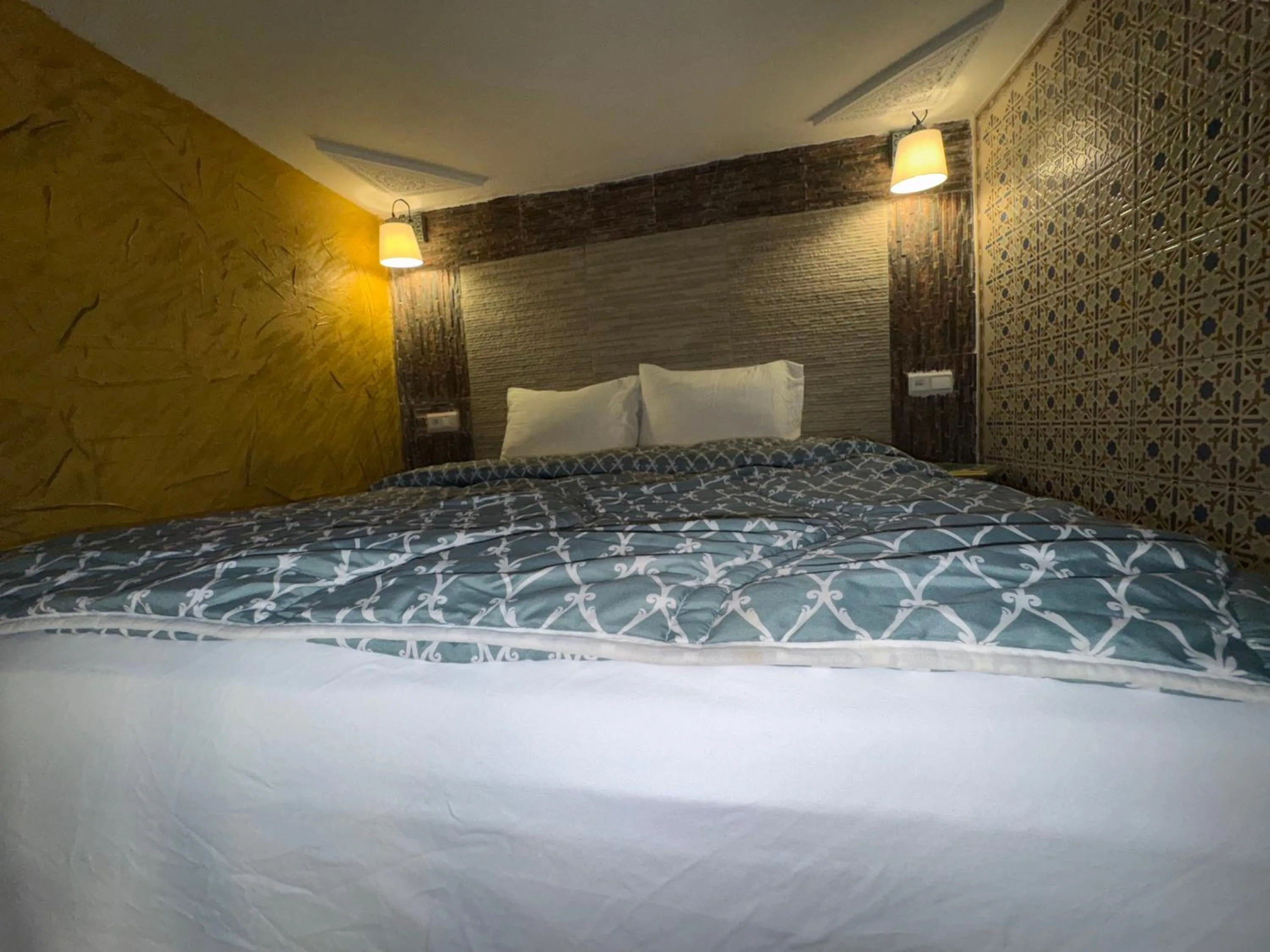 Bed in RIAD ESMERALDA By Dar Ouezzani