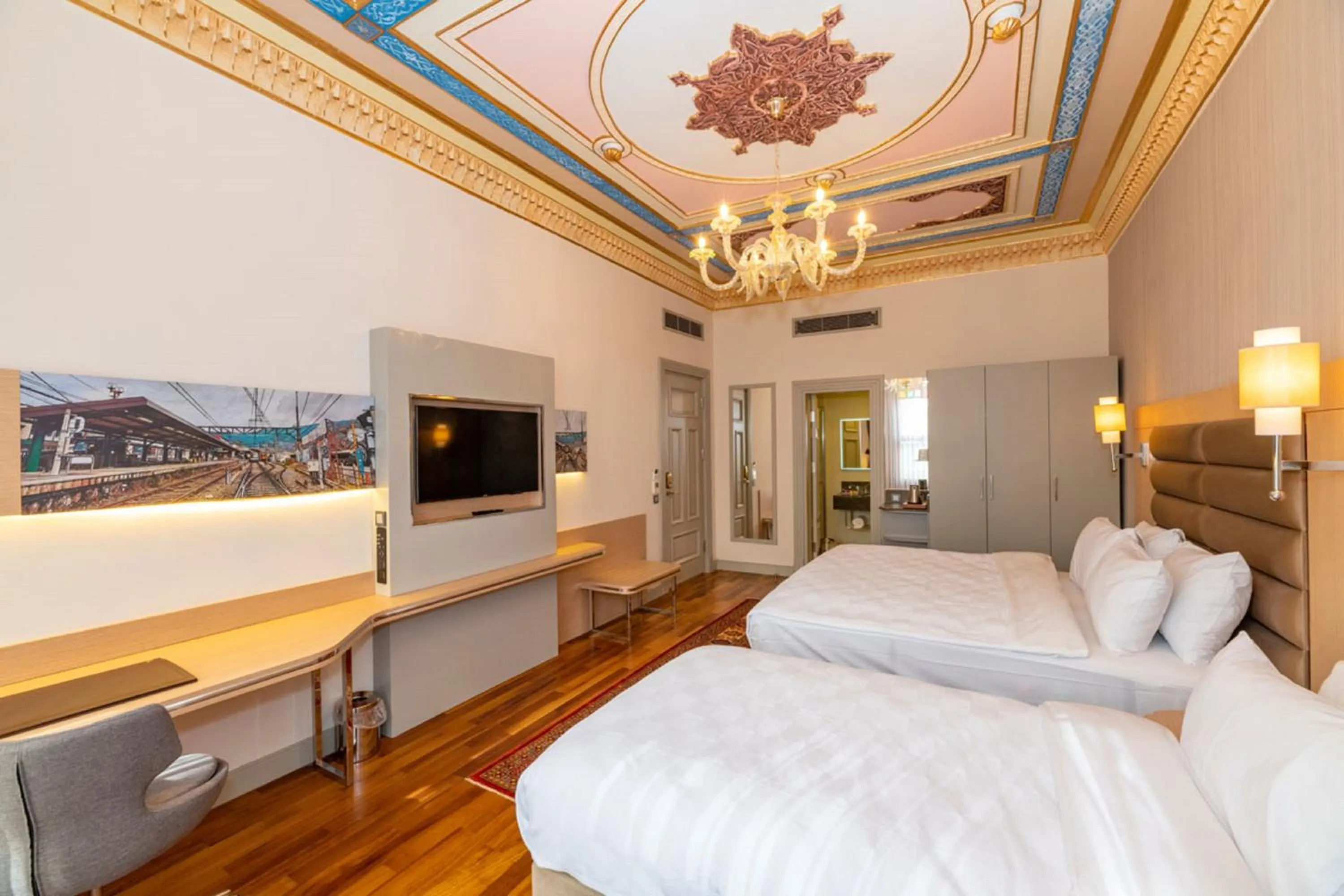 Bed in Blue Gilroy Hotel