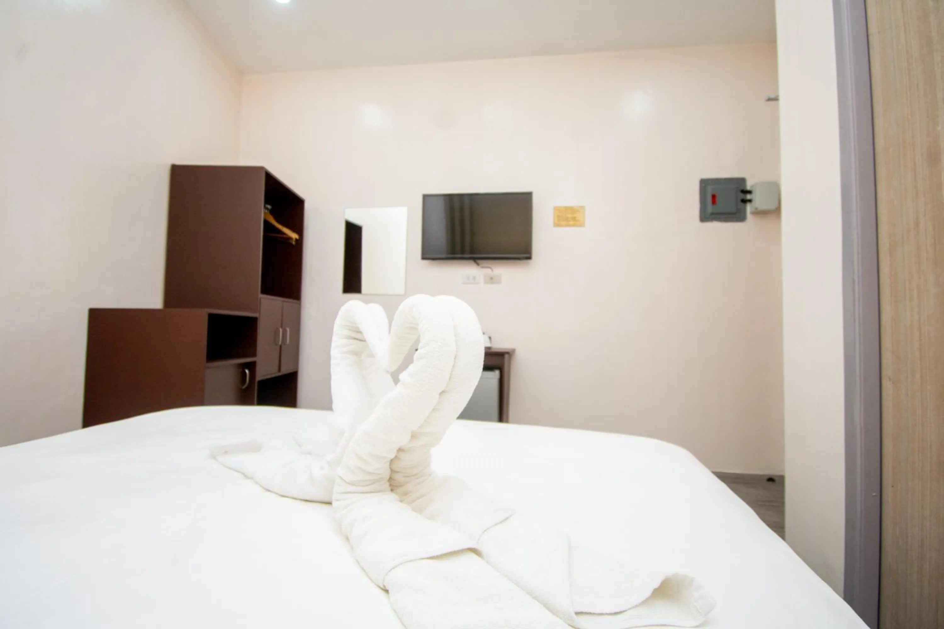 Bed in Emerald Island Hotel