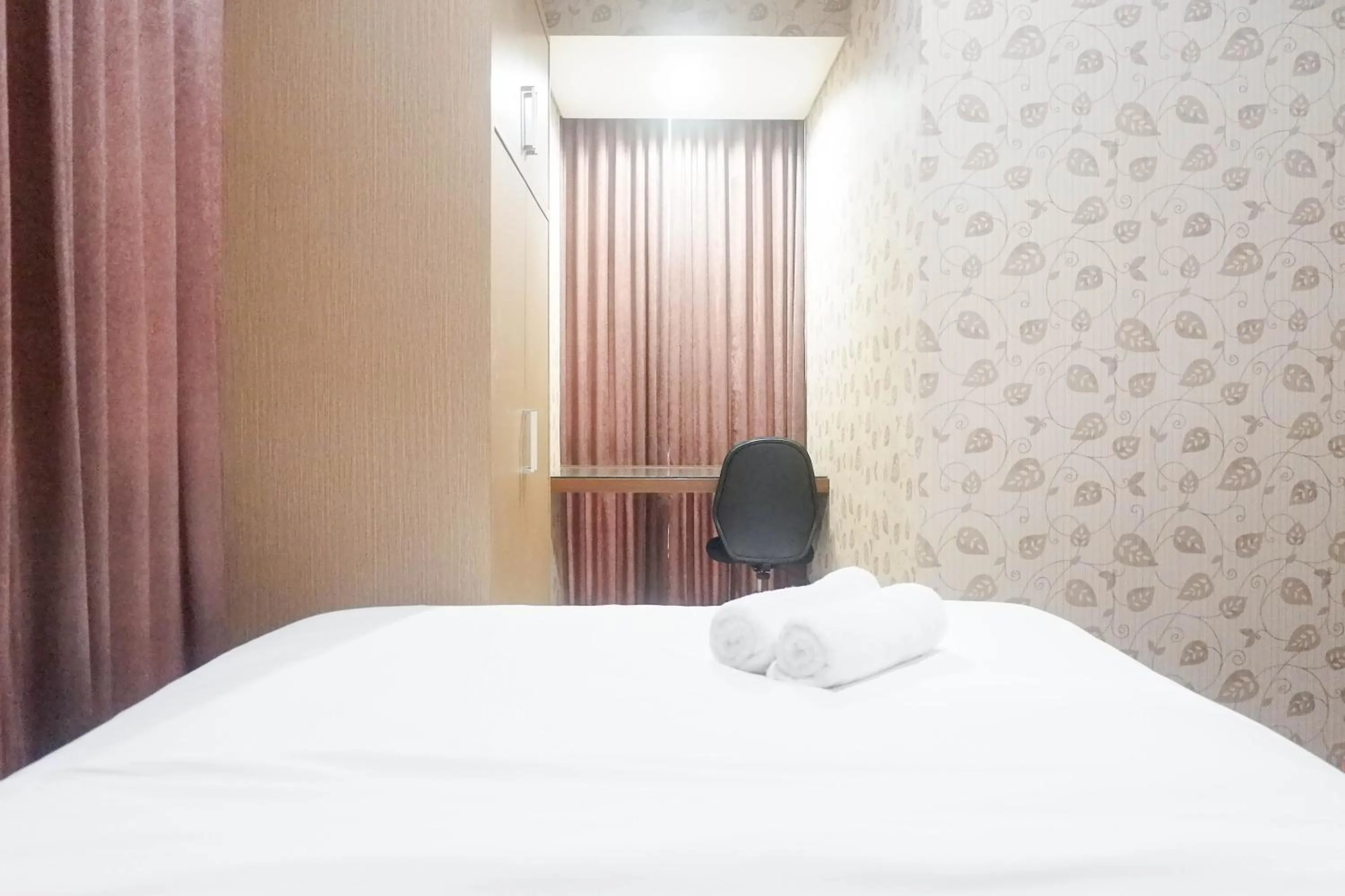 Bedroom, Bed in Minimalist 2BR Apartment at Tamansari Papilio By Travelio