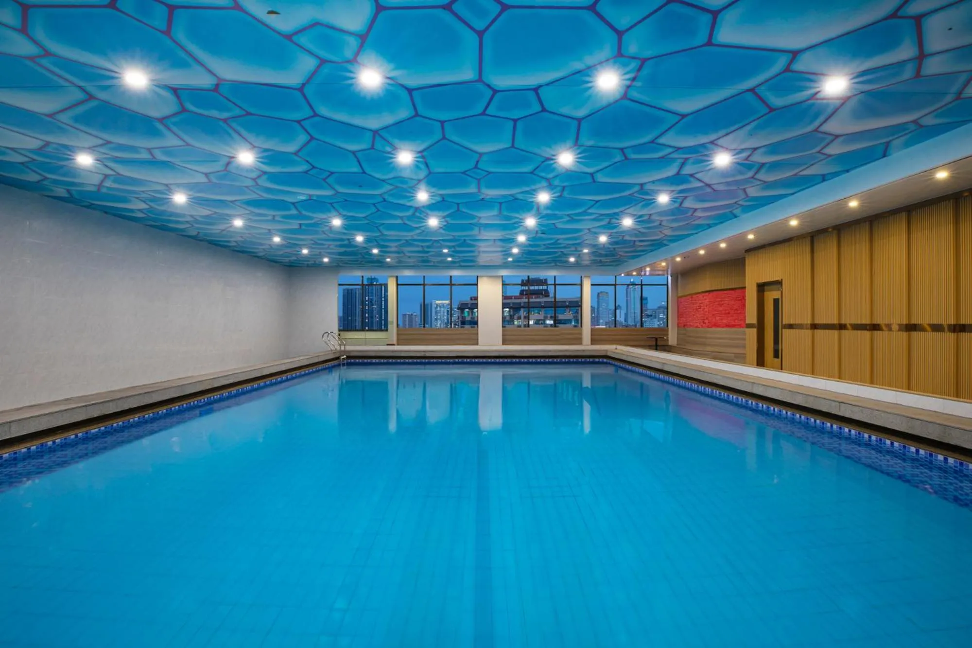 Swimming pool in voco Wuhan Xinhua by IHG