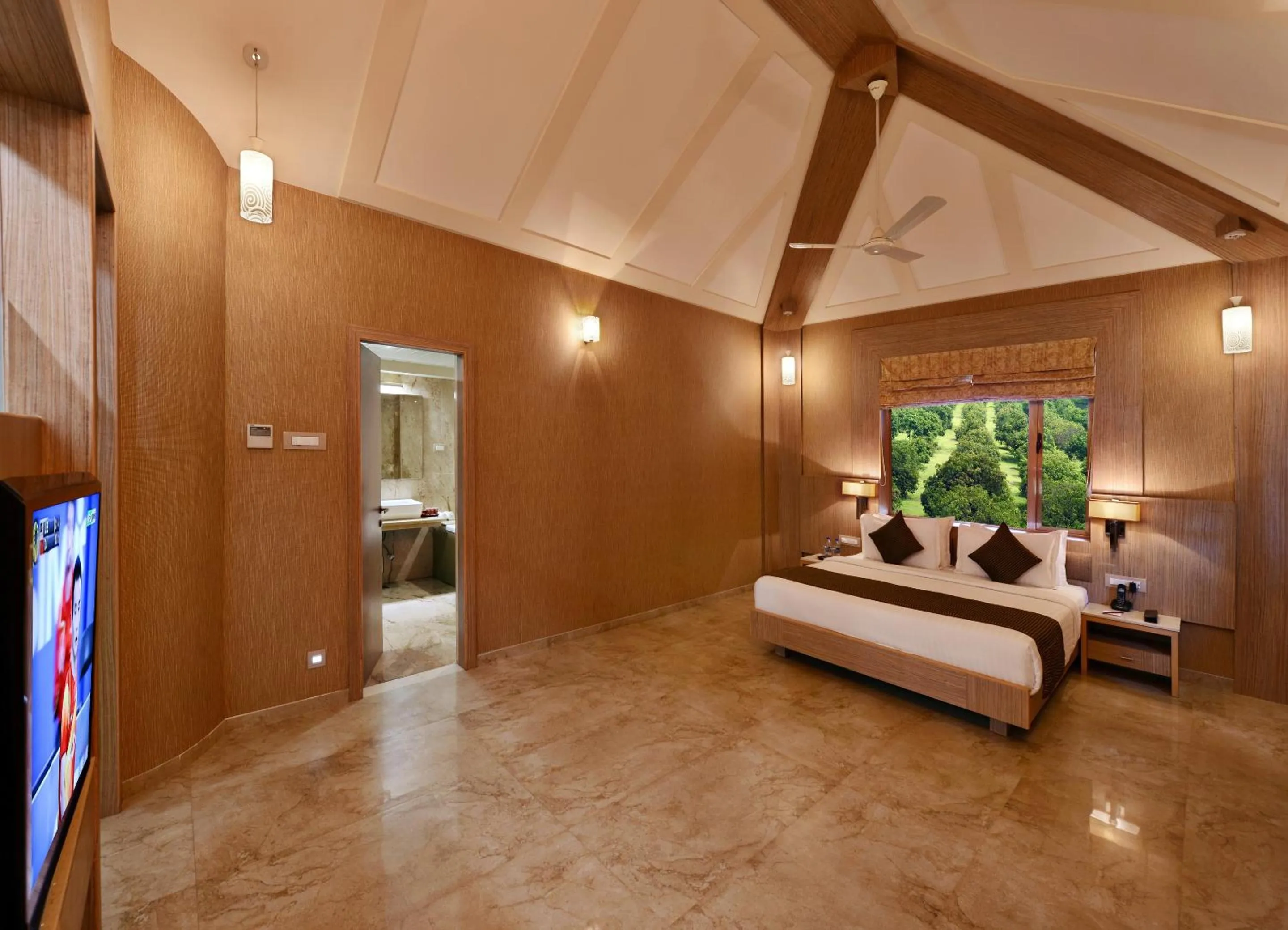 Photo of the whole room, Bed in Sarovar Portico Sasangir