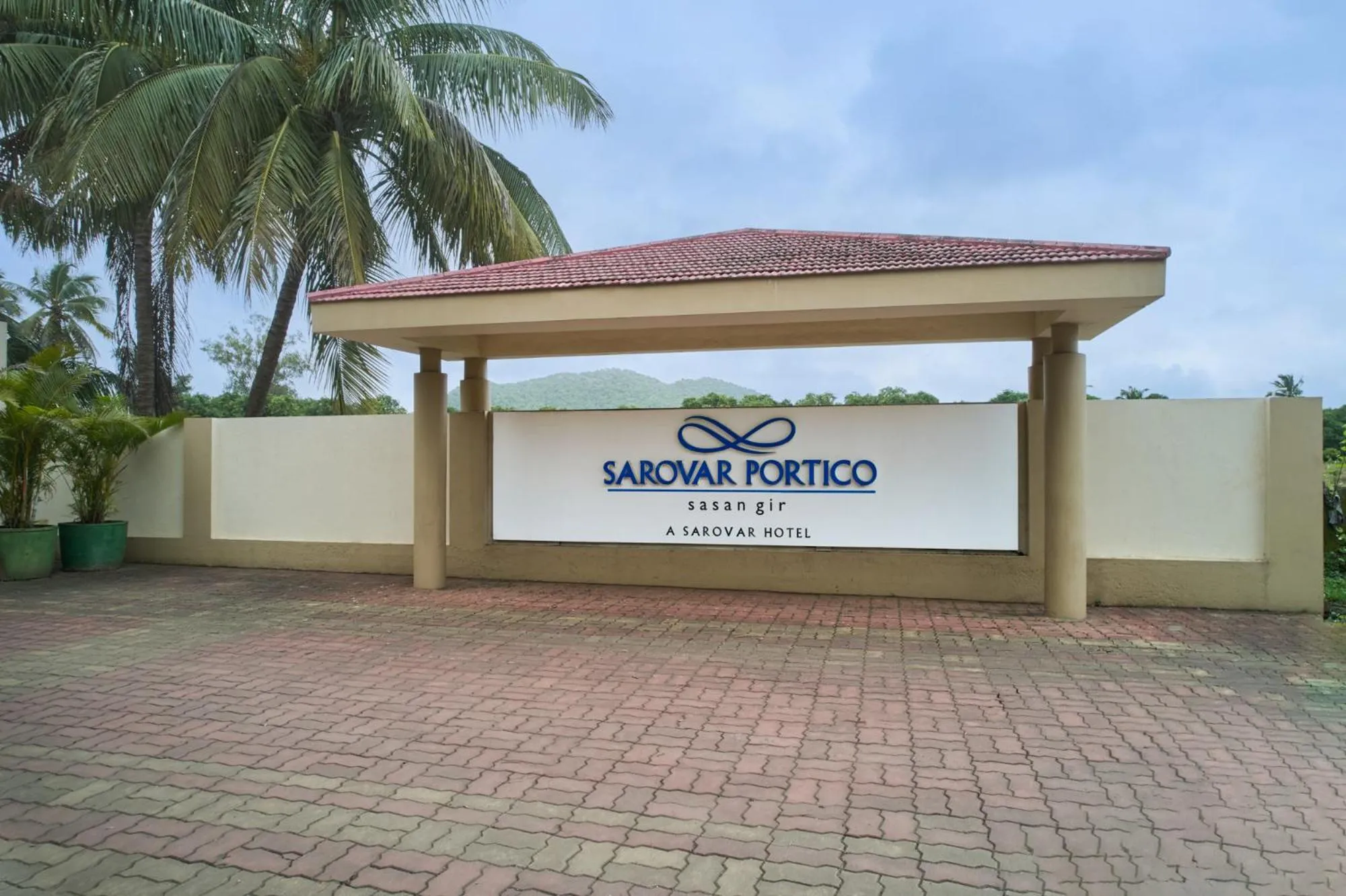 Property logo or sign in Sarovar Portico Sasangir