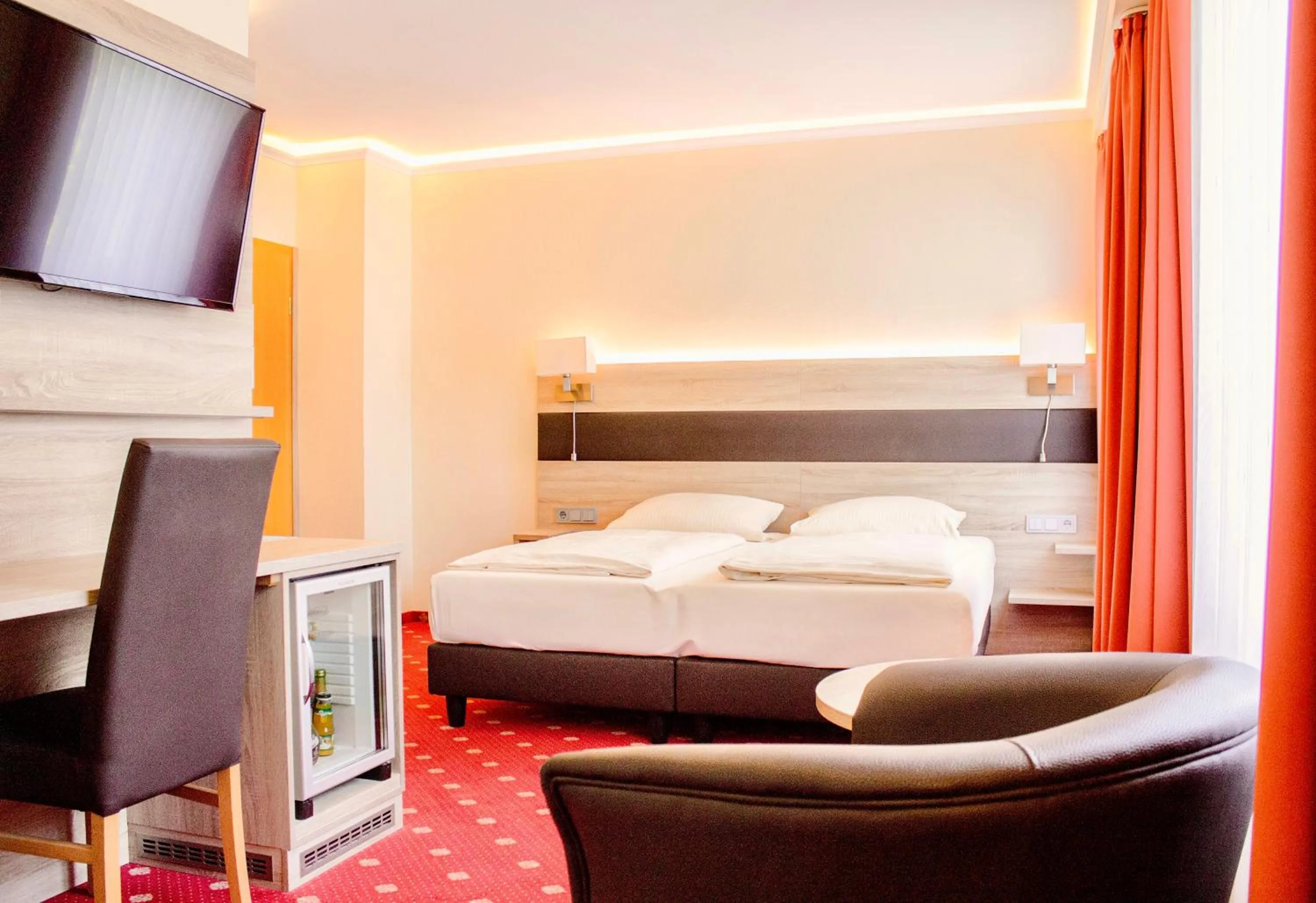 Bed in Hotel Kriemhild am Hirschgarten