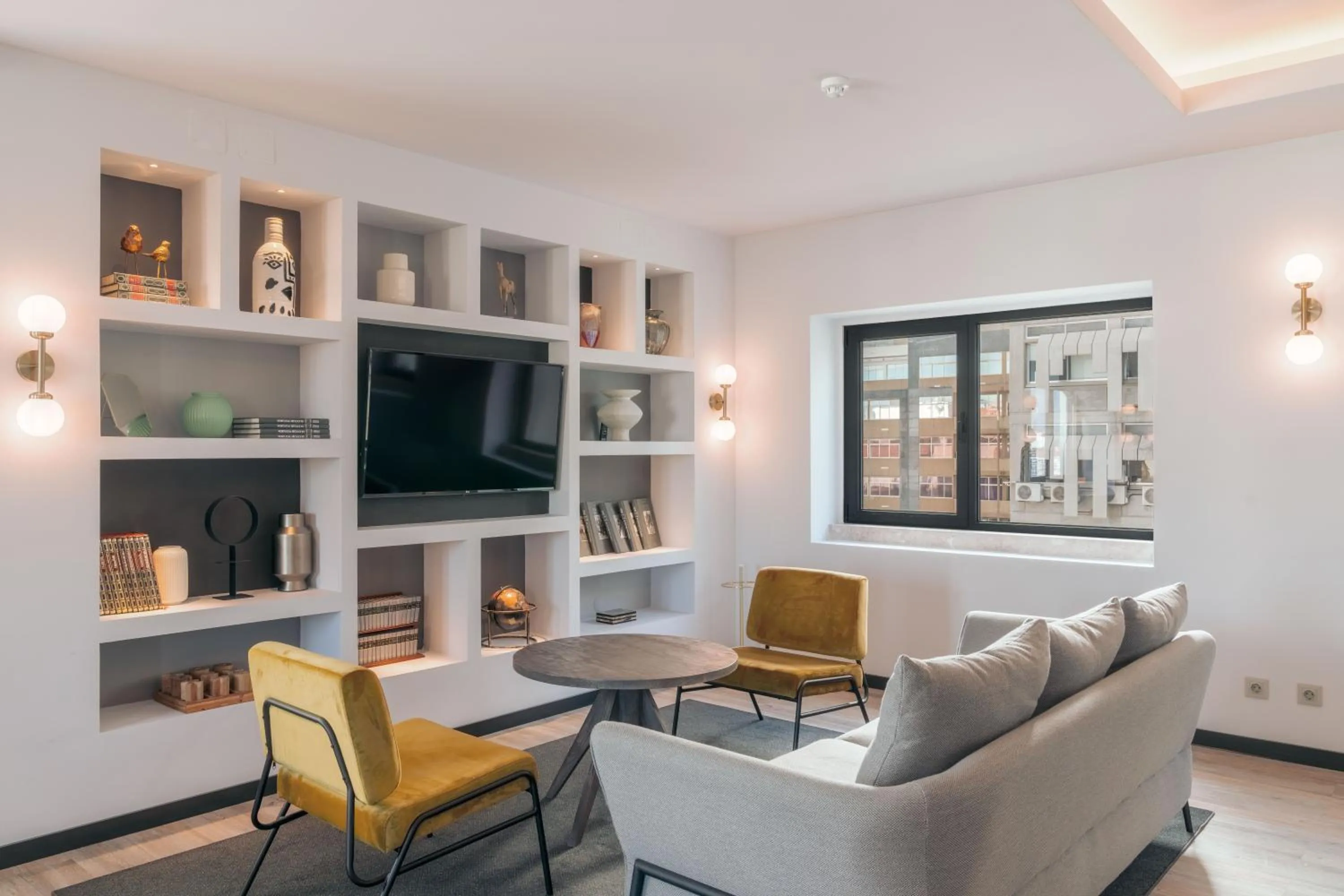 Communal lounge/ TV room in Pestana Lisboa Vintage City Center Suites