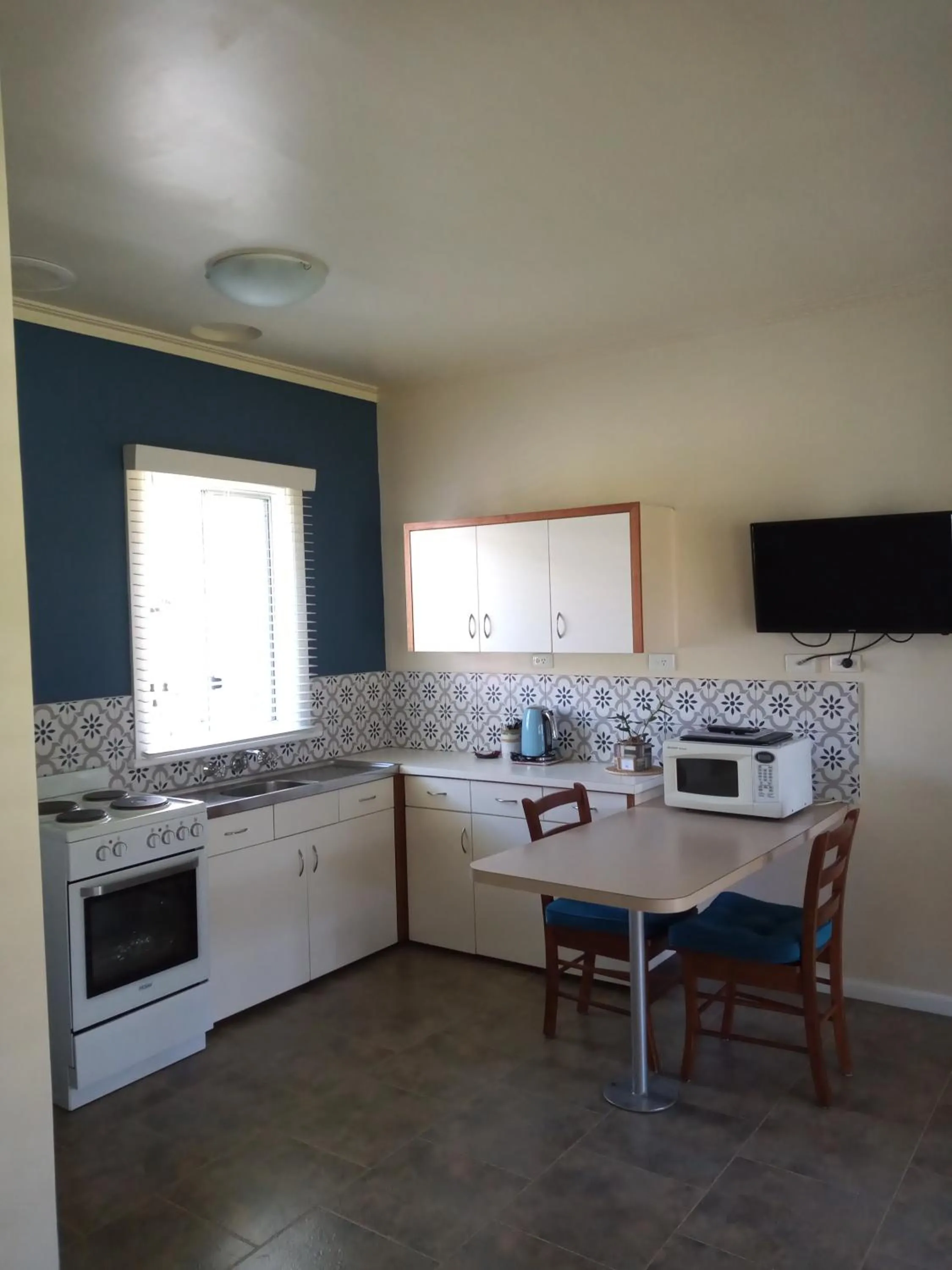 kitchen in Lakes Entrance Waterfront Cottages with King Beds