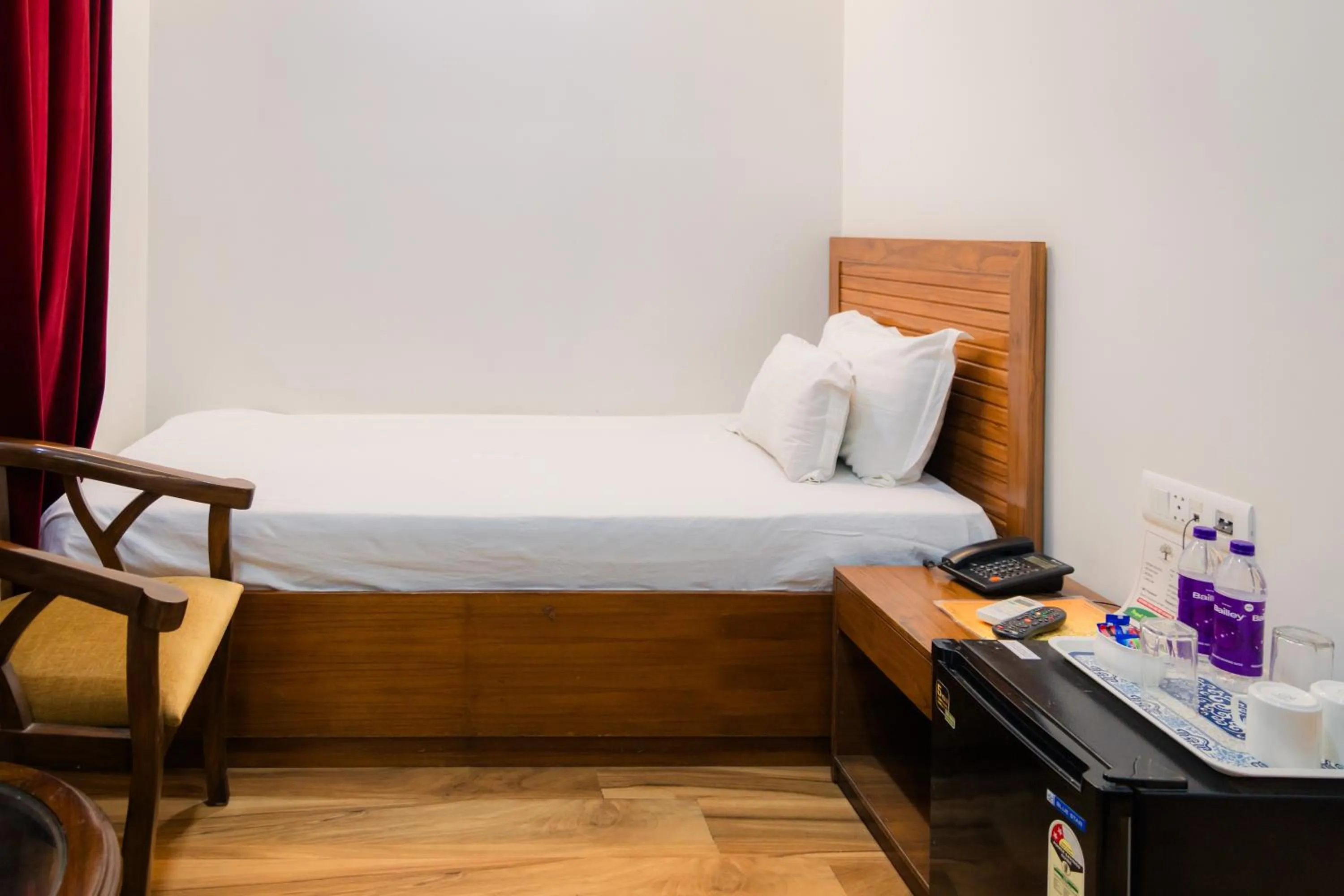 Bed in Peepal Tree Residency