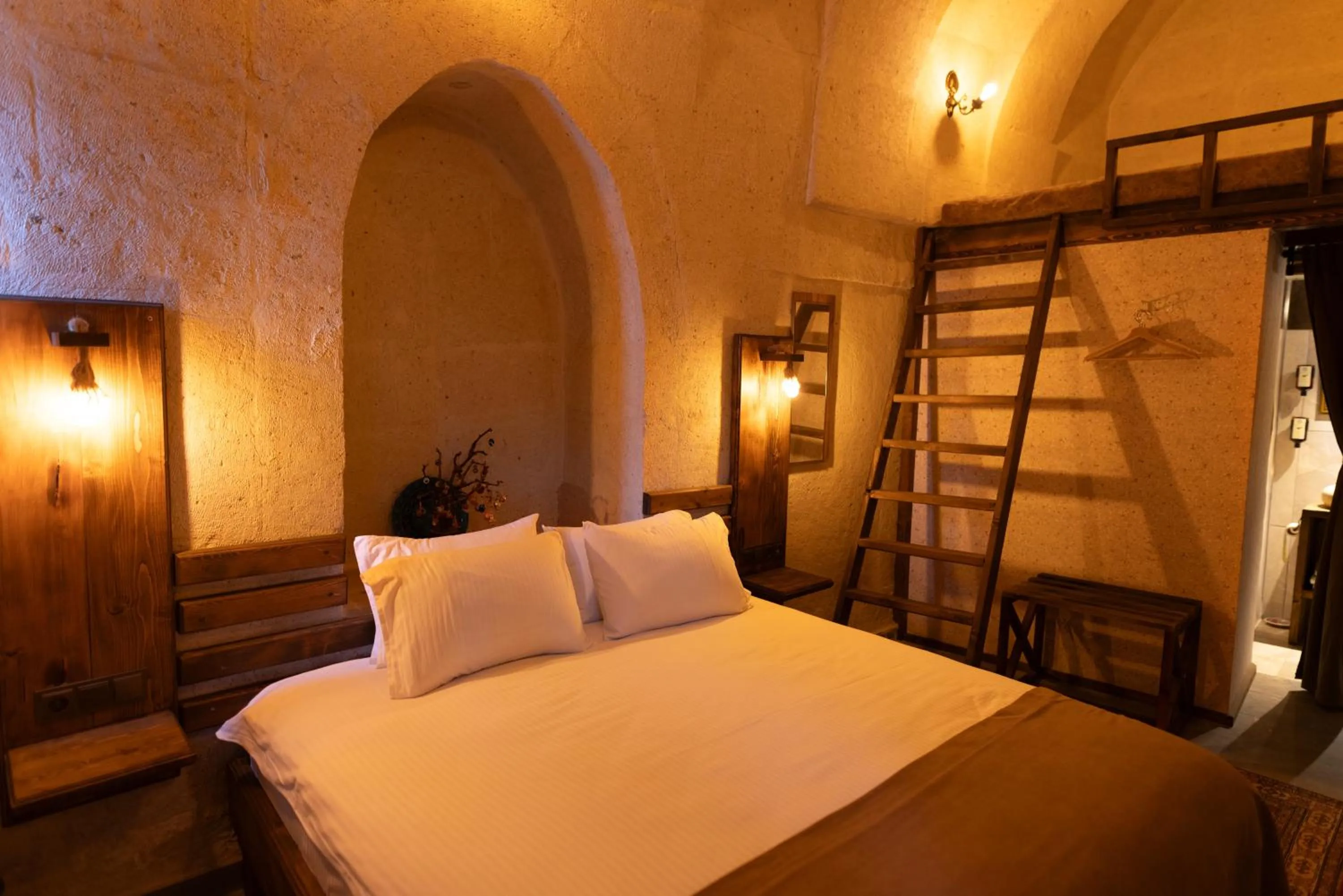 Bed in Lemon Cave Suites