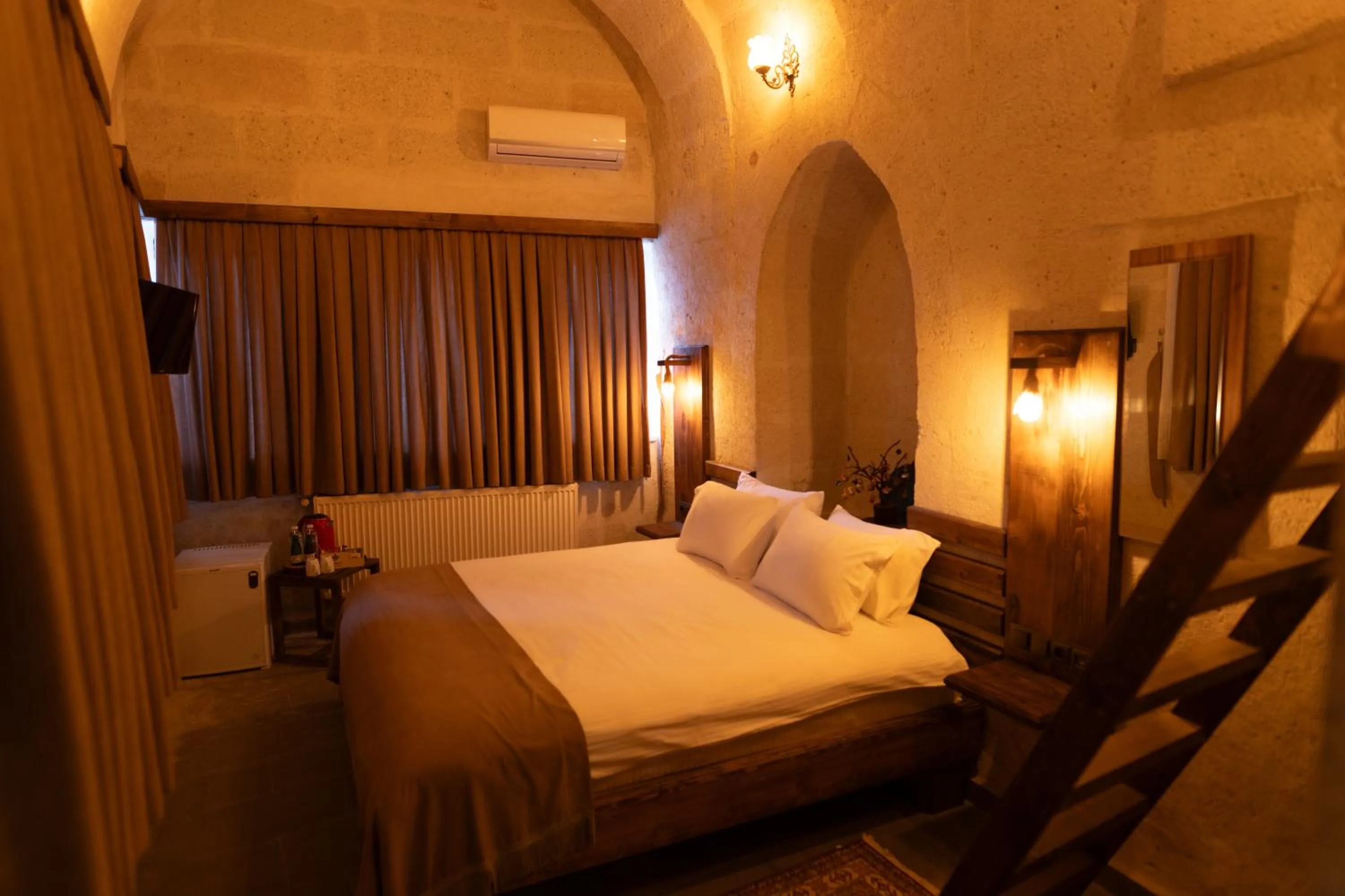 Bed in Lemon Cave Suites