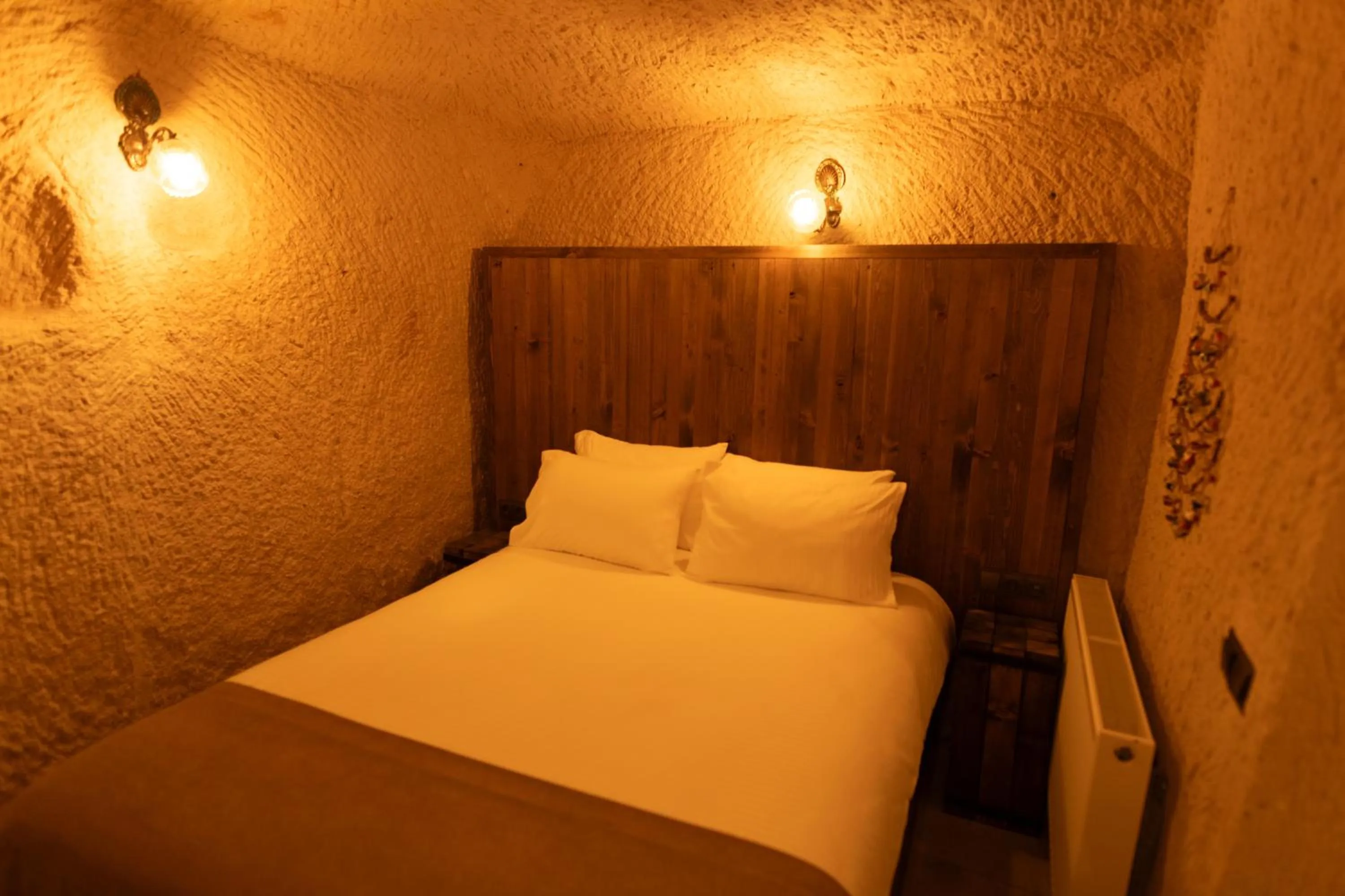 Bed in Lemon Cave Suites