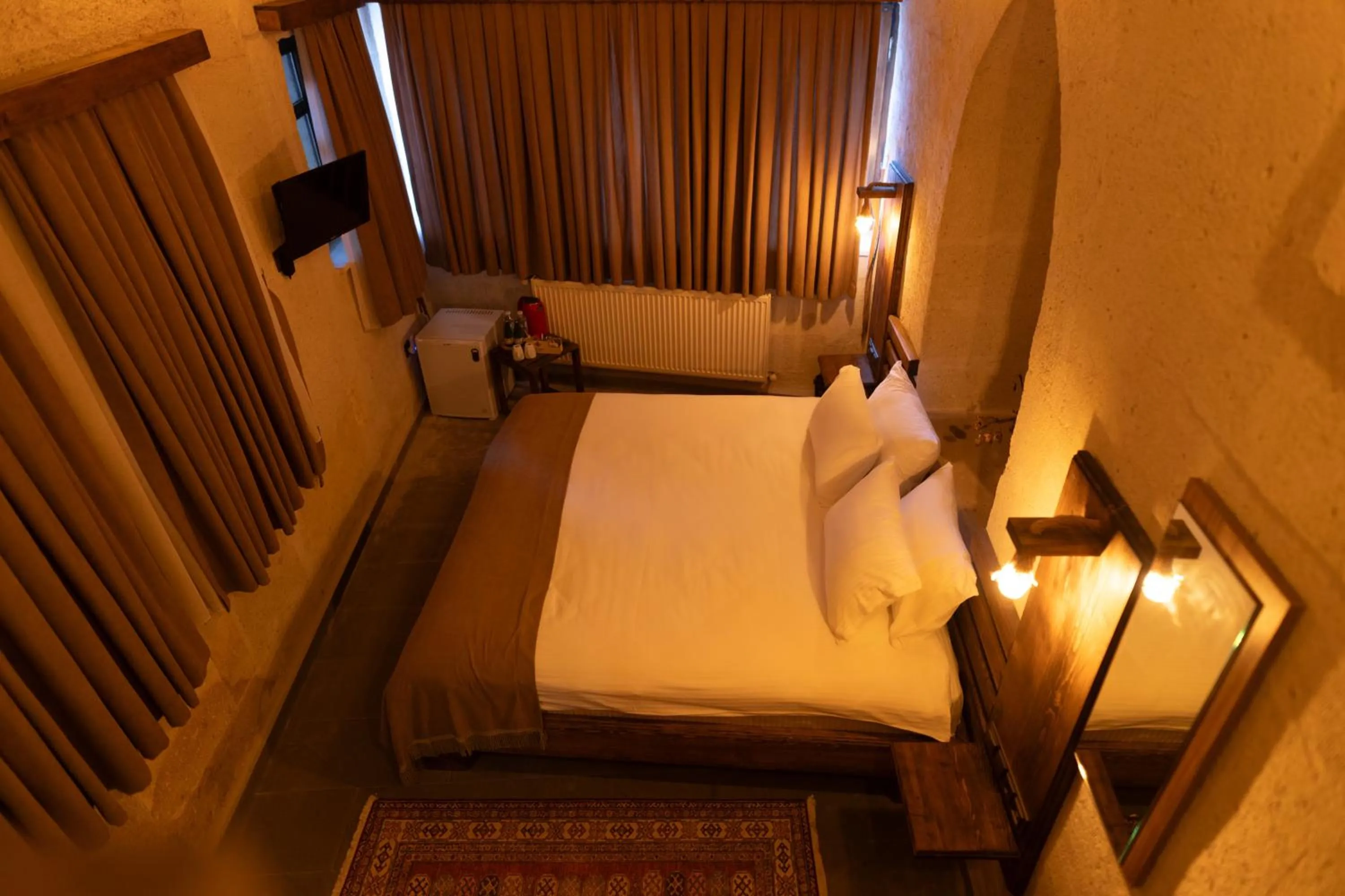 Bed in Lemon Cave Suites