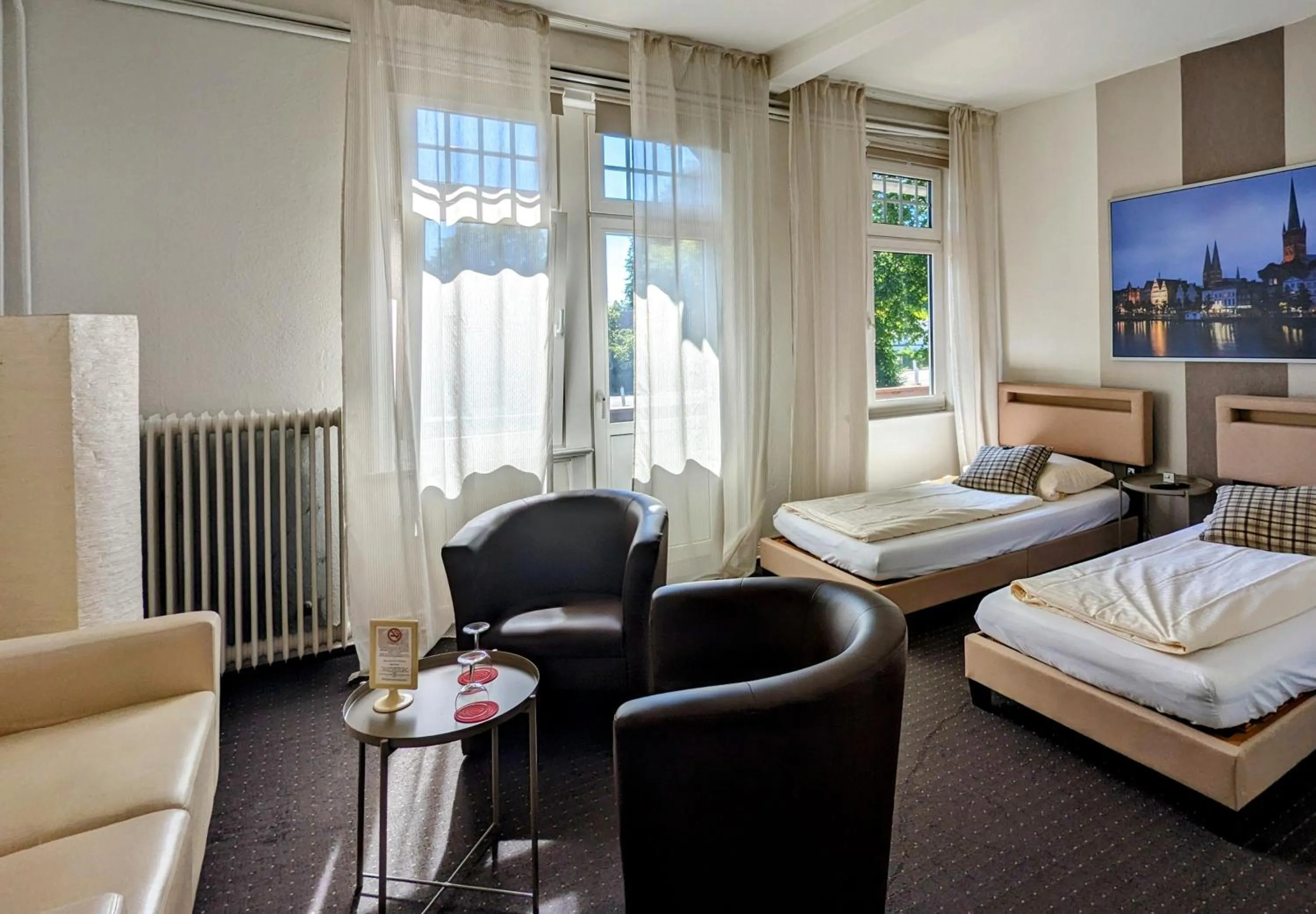 Seating area, Bed in Hotel Schweizerhaus
