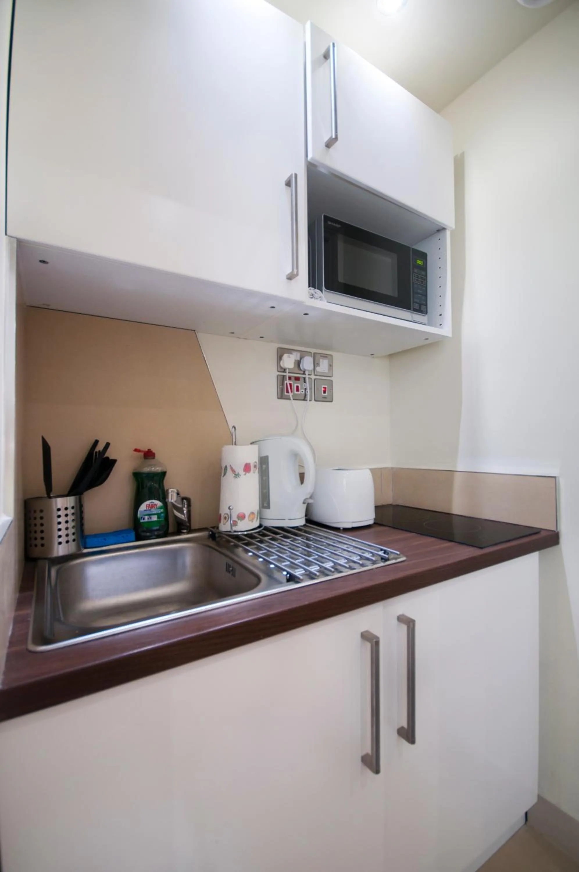 Kitchen or kitchenette in Palmerston Suites