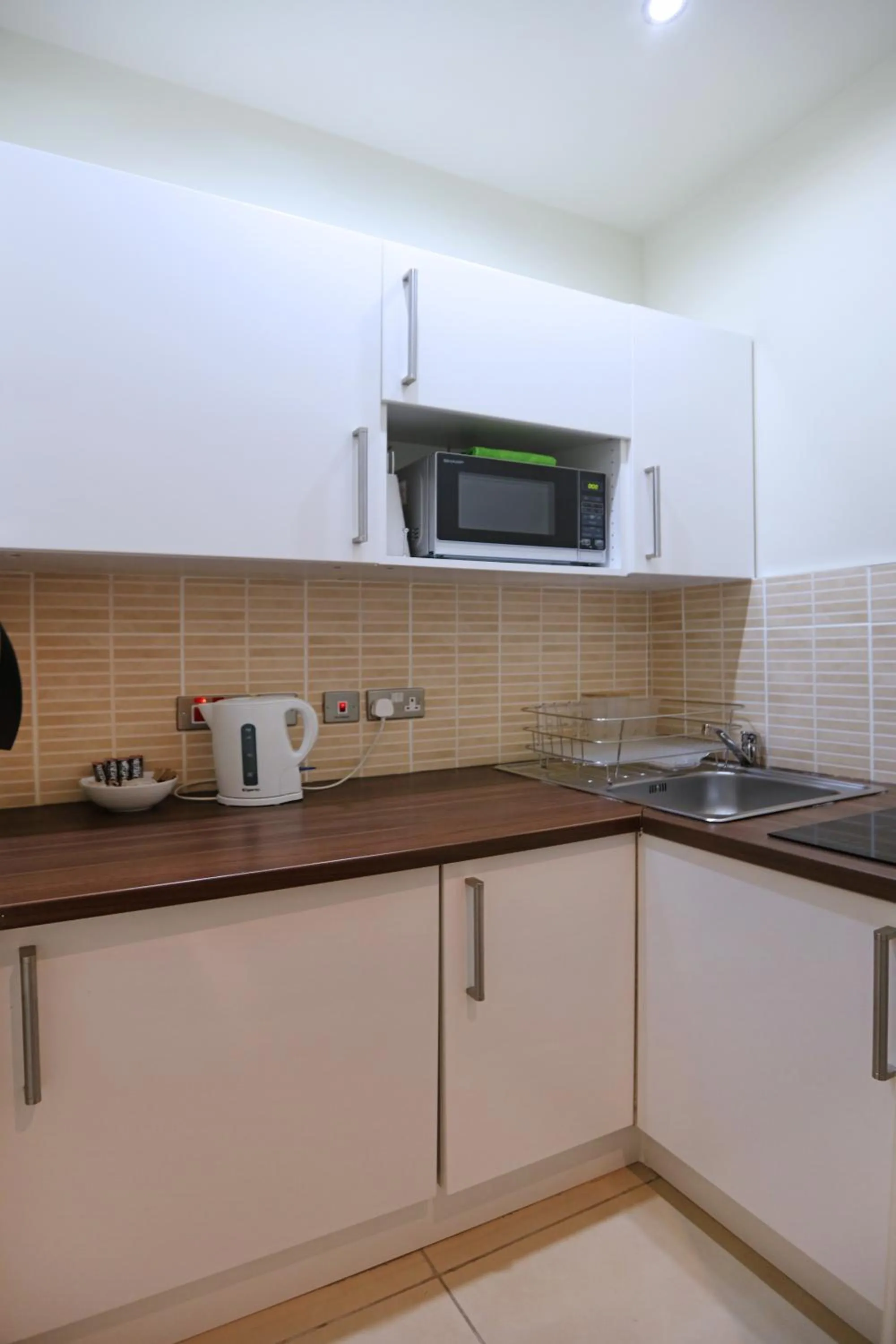Kitchen or kitchenette in Palmerston Suites