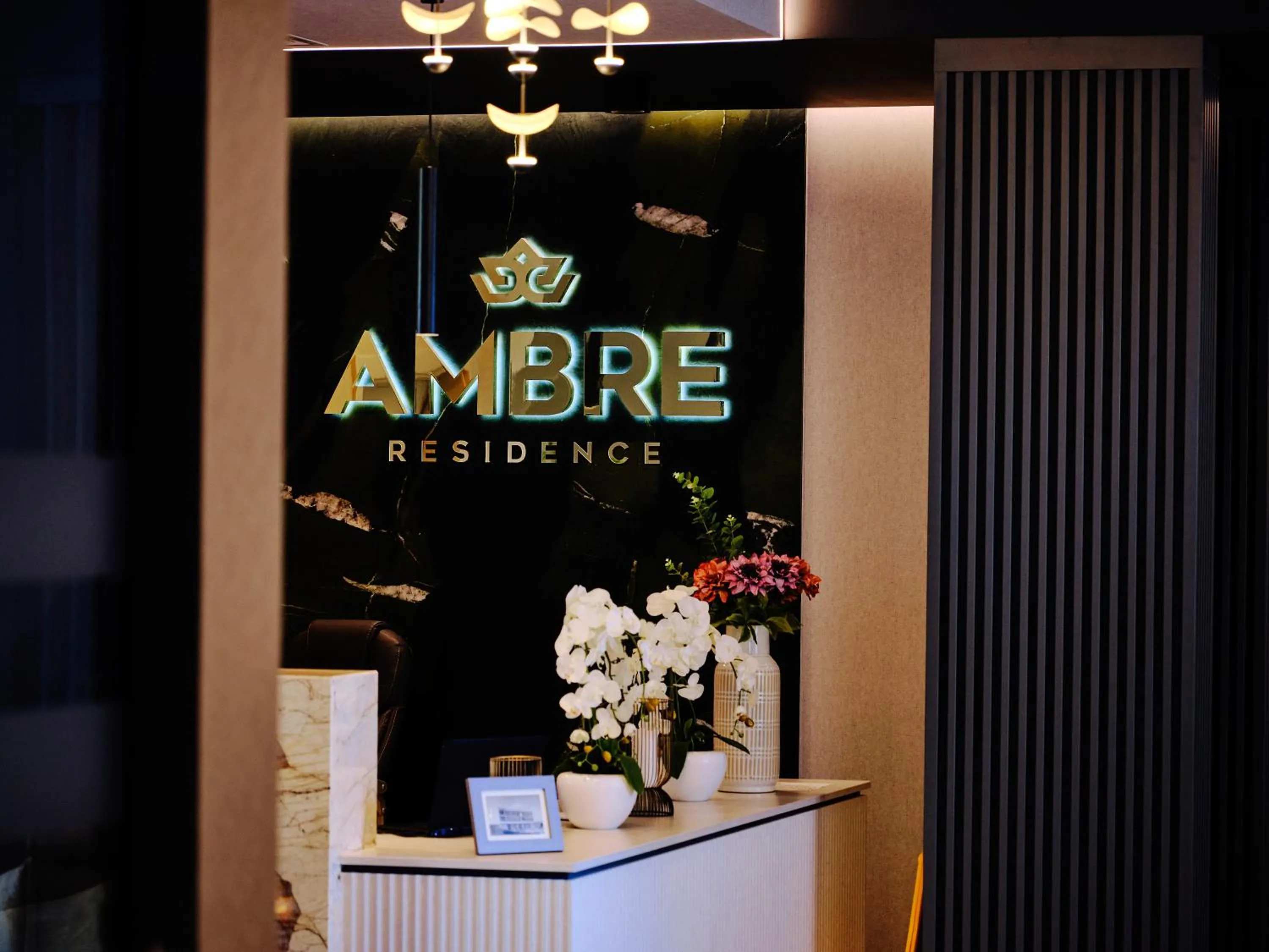 Property logo or sign in Rezydencja AMBRE