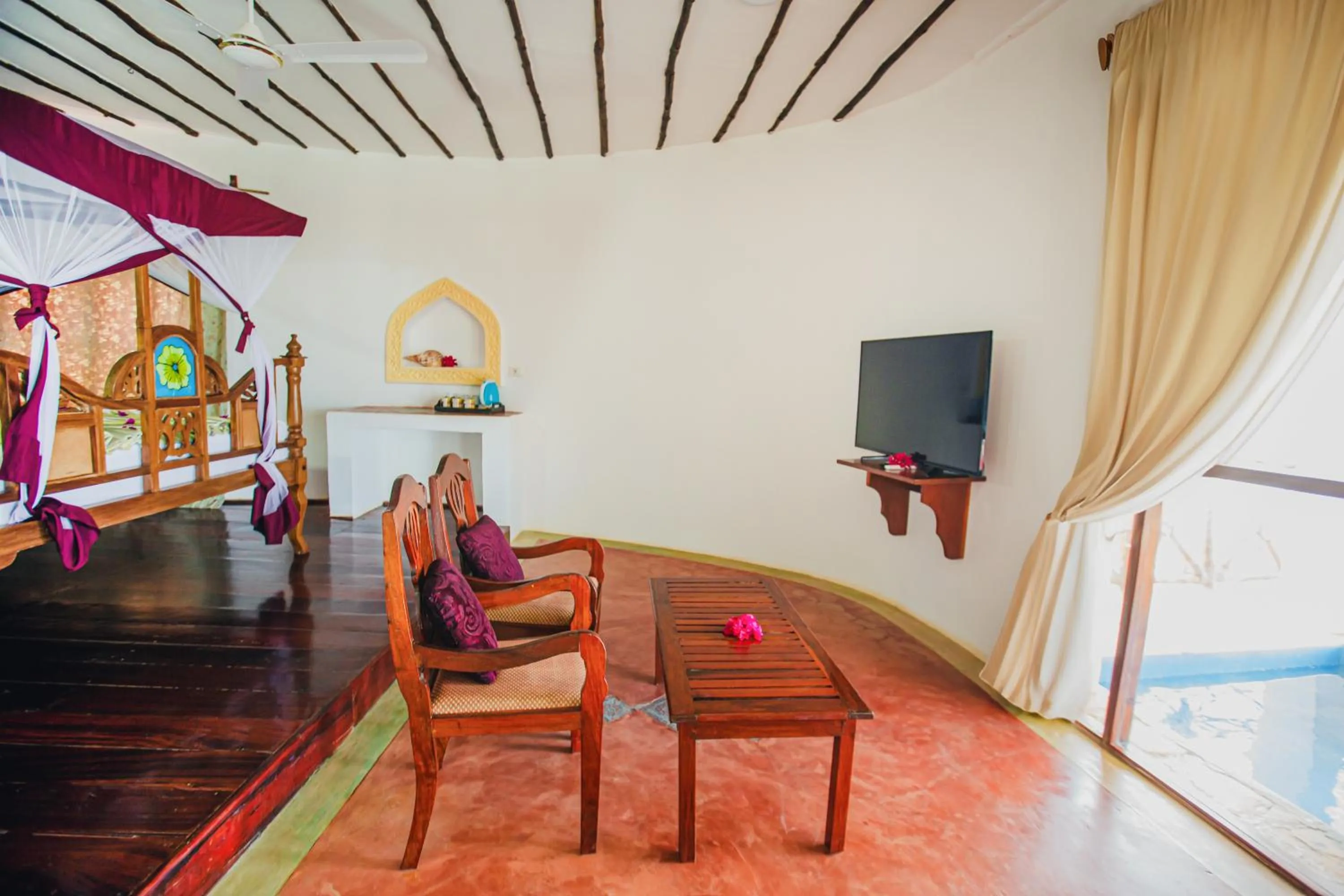 Communal lounge/ TV room in AHG Waridi Beach Resort & SPA