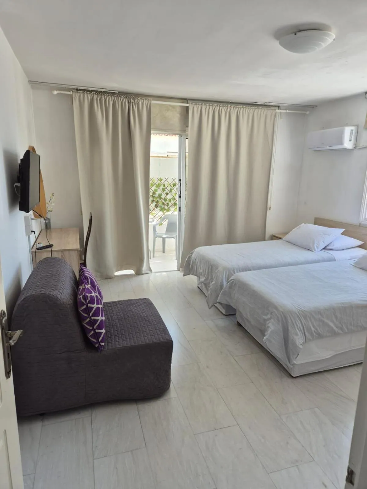 Bed in Myriama Apartments