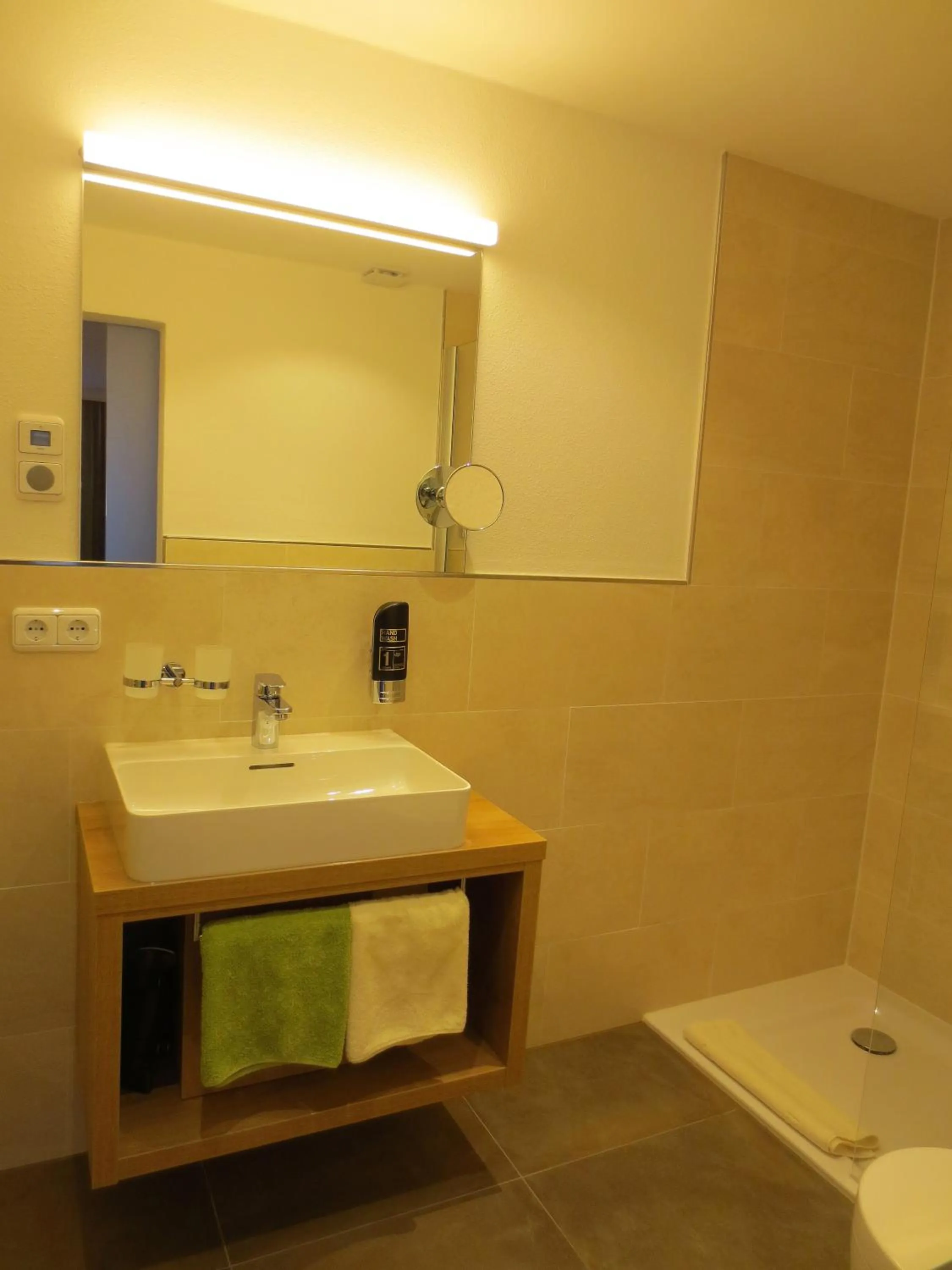 Bathroom in Hotel Alp Inn - Chiemgaukarte inclusive