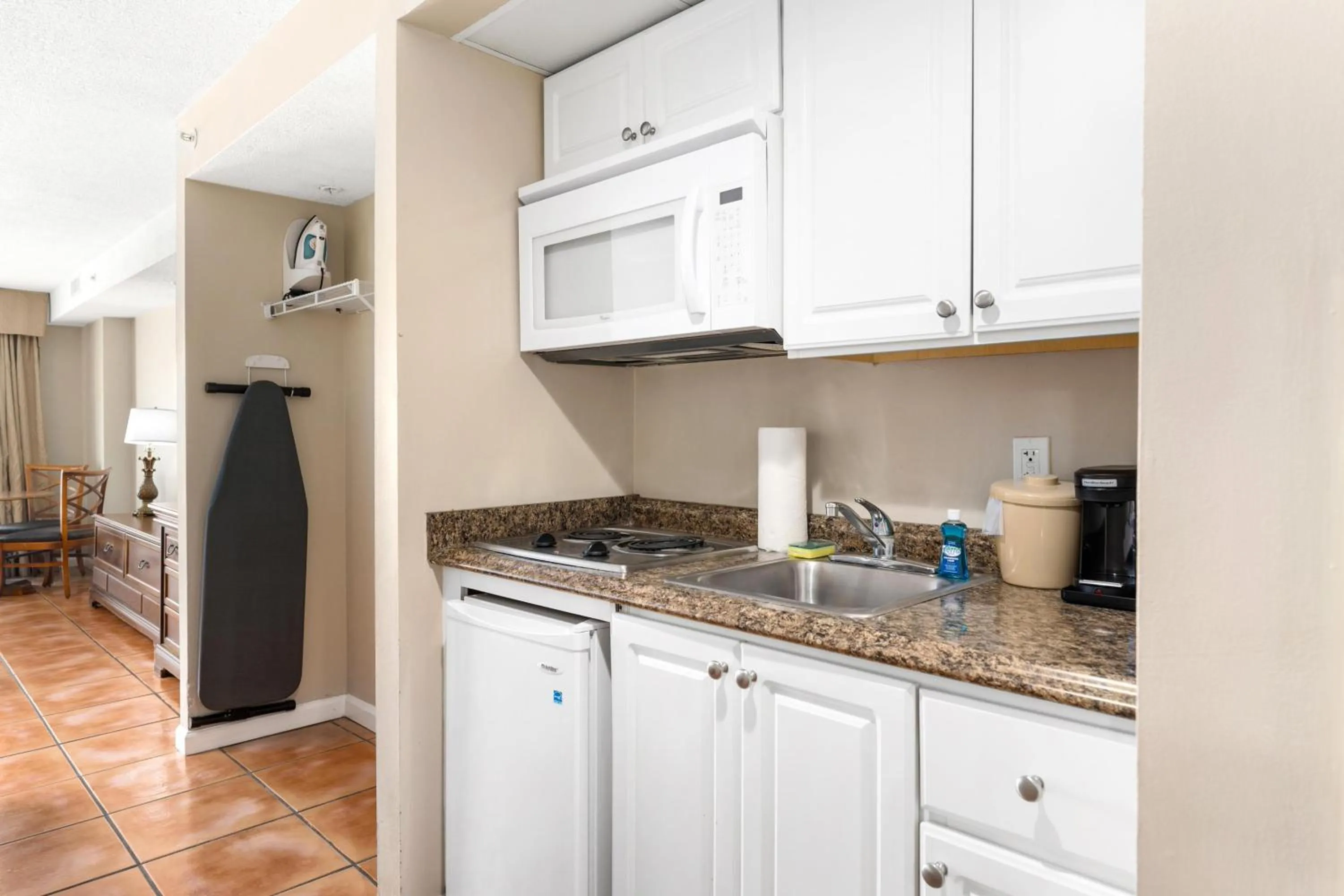 Kitchen or kitchenette in Tidelands Caribbean Boardwalk Hotel and Suites