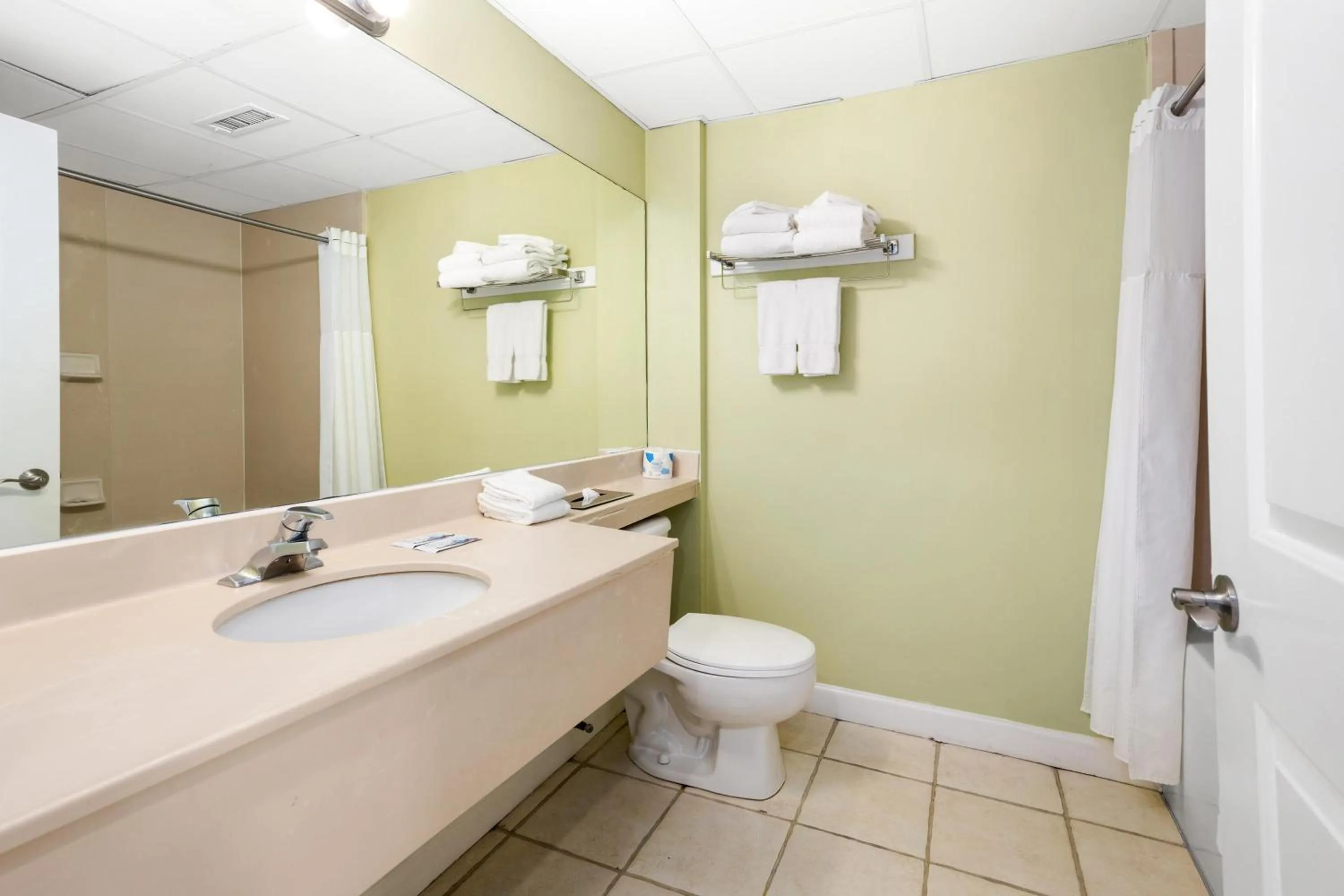 Bathroom in Tidelands Caribbean Boardwalk Hotel and Suites