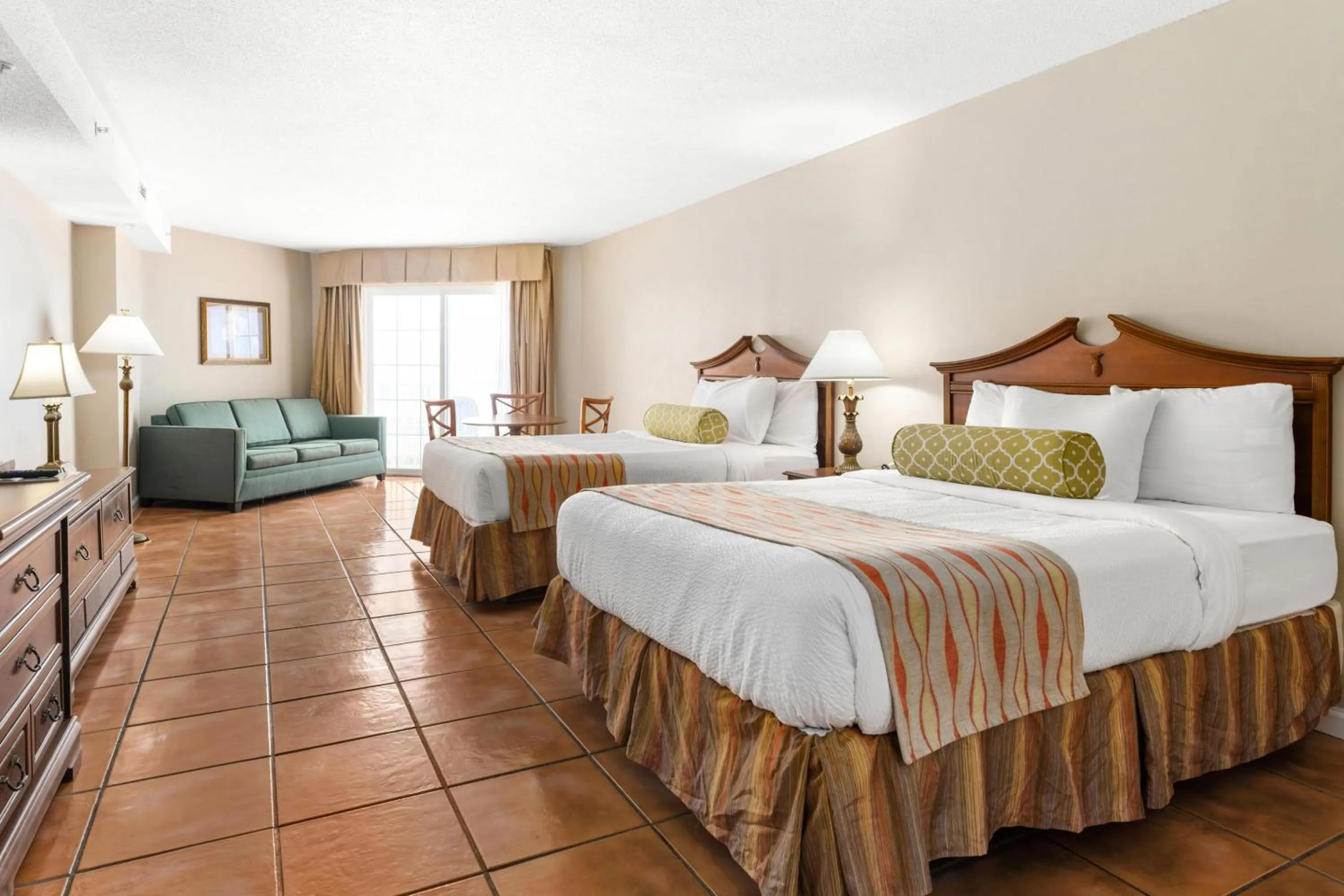 King Room with 2 King Beds & Sleep Sofa - Partial Ocean View in Tidelands Caribbean Boardwalk Hotel and Suites