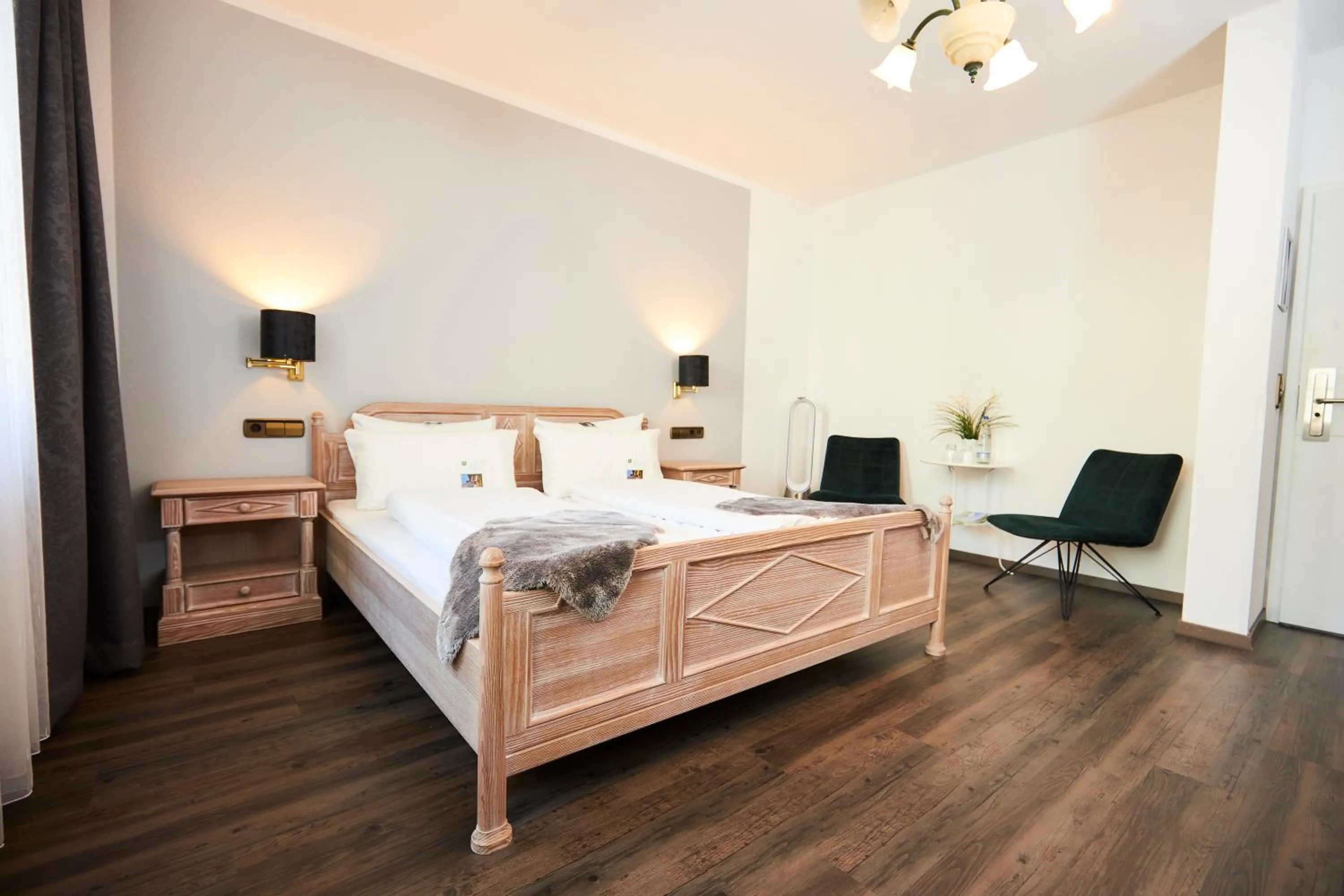 Photo of the whole room, Bed in Flair Hotel Vier Jahreszeiten