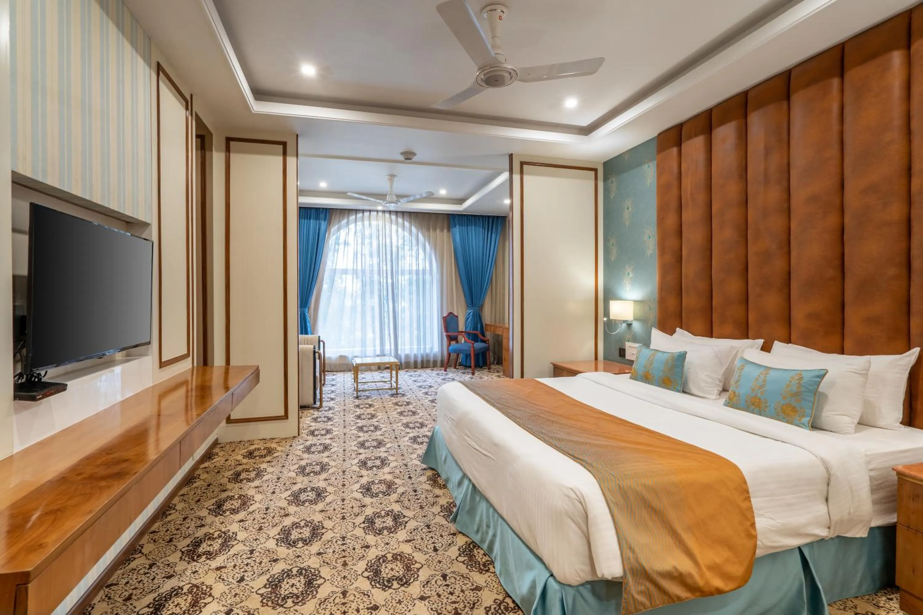 Bed in Hukam's Lalit Mahal - Hotel Convention Club