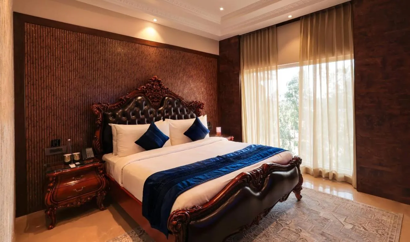 Bed in Hukam's Lalit Mahal - Hotel Convention Club