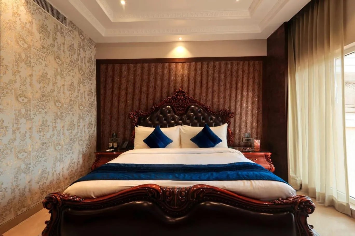 Bed in Hukam's Lalit Mahal - Hotel Convention Club
