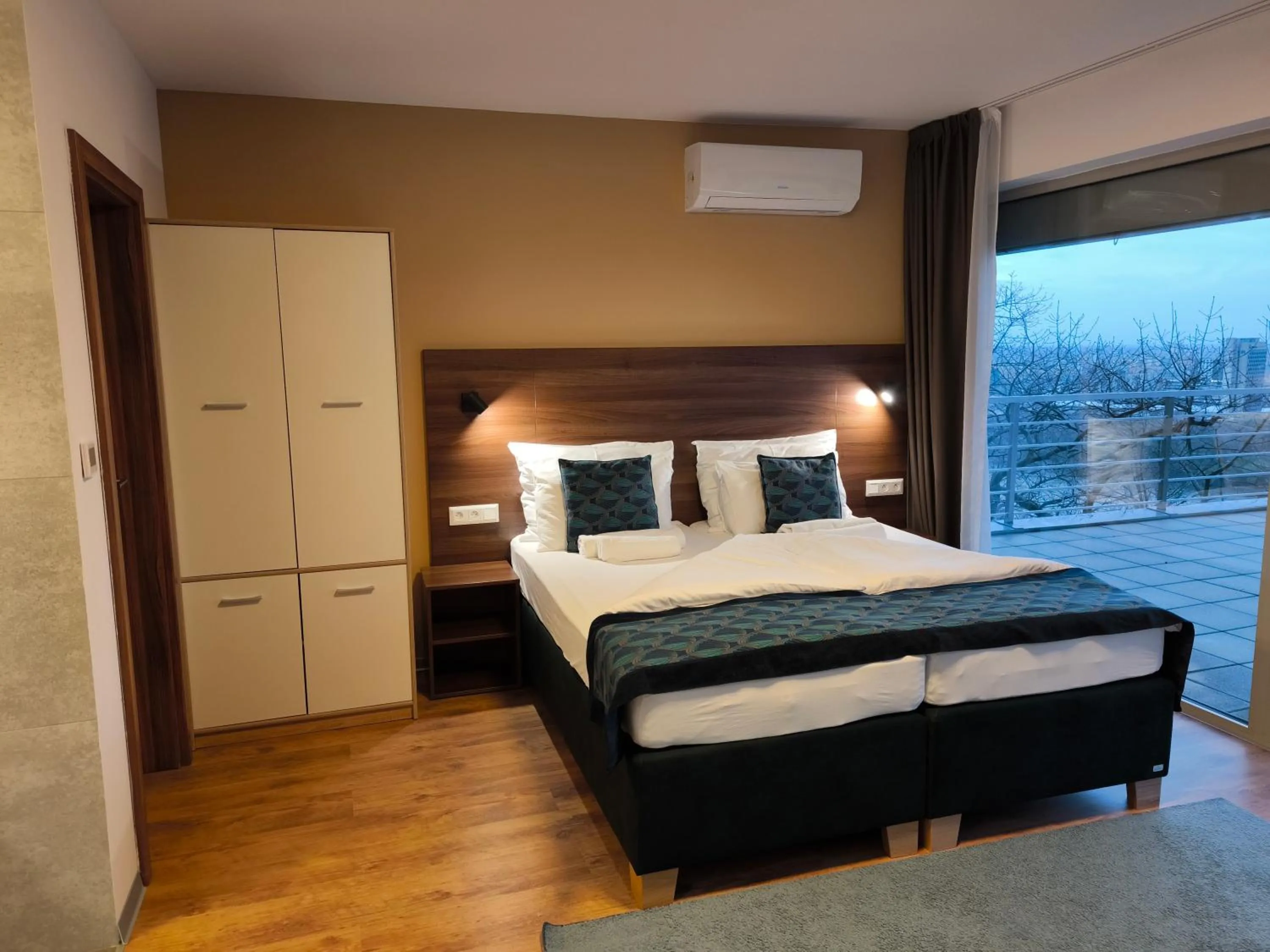 Bed in River View Apartments Hotel
