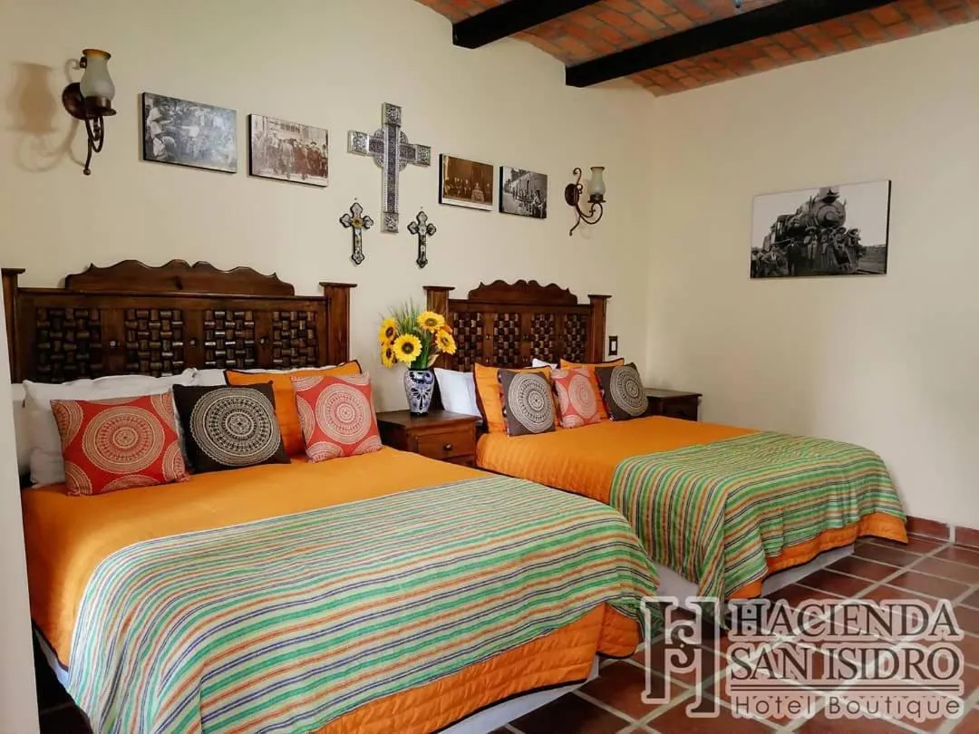 Bed in Hotel Hacienda San Isidro