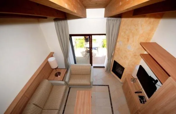 Communal lounge/ TV room in Tassido Coda Resort